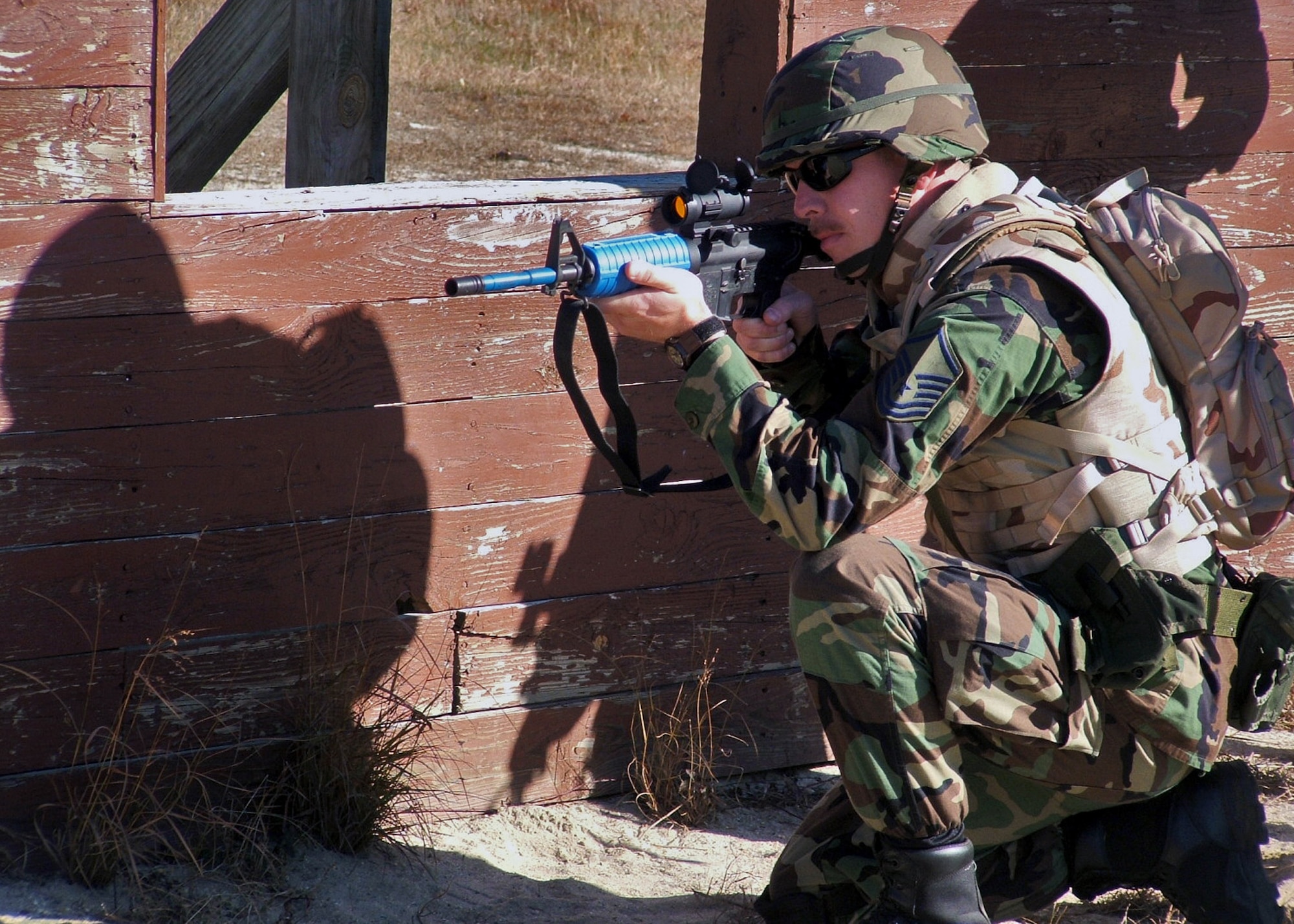 FORT DIX, N.J. (AFPN) -- A master sergeant participating in the Combat Interrogator Course 06-1 takes up a firing position in a close quarters battle at a tactical range. The class was taught by the 421st Combat Training Squadron at the Air Mobility Warfare Center, Fort Dix, Nov. 14. (U.S. Air Force Photo by Tech. Sgt. Scott T. Sturkol)