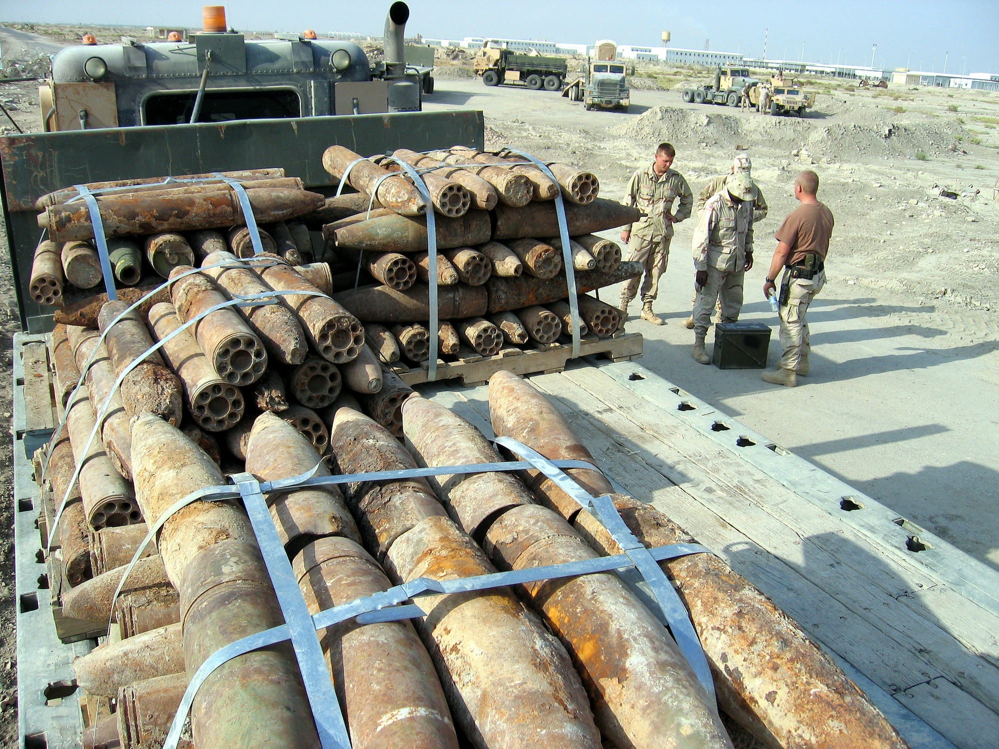 IRAQ (AFPN) -- Volunteers move ordnance to Ali Base, Iraq, for disposal. Much of the ordnance was in poor condition and required careful ordnance identification and sorting before being palletized for transportation. (U.S. Air Force photo)