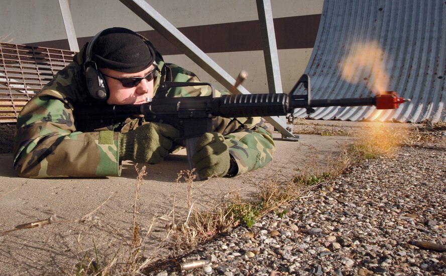 MINOT AIR FORCE BASE, N.D. (AFPN) -- Staff Sgt. Kevin Beasley fires his M-16 rifle during an exercise. The exercise on Nov. 10 trained Airman here on expeditionary combat skills before their Air and Space Expeditionary Force deployments. Sergeant Beasley is the noncommissioned officer in charge of the 5th Civil Engineer Squadron explosive ordnance disposal flight. (U.S. Air Force photo by Airman Christopher Boitz) 