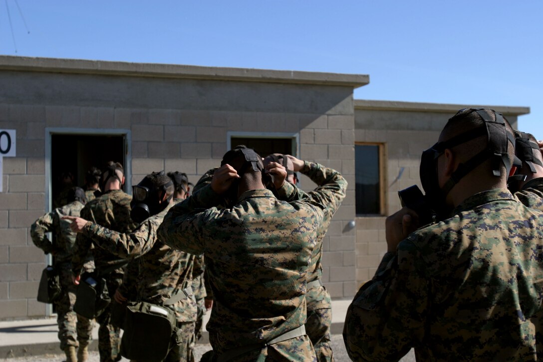 Marines with the 15th Marine Expeditionary Unit prepare to enter the gas chamber during a mask confidence exercise at the 33 Area here. The 15th MEU participated in the exercise to ensure that the individual Marines and Sailors in the unit are confident in their field protective mask while operating in a contaminated environment.
