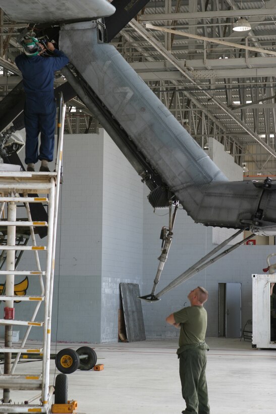 Marines from Marine Heavy Helicopter Squadron 363 perform routine maintenance on CH-53Ds Nov. 16, at Marine Corps Air Field on Marine Corps Base Hawaii, Kaneohe Bay. The Marines had a surprise drill pulled on them Nov. 14 to see if they could handle a situation if an accident should ever arise.