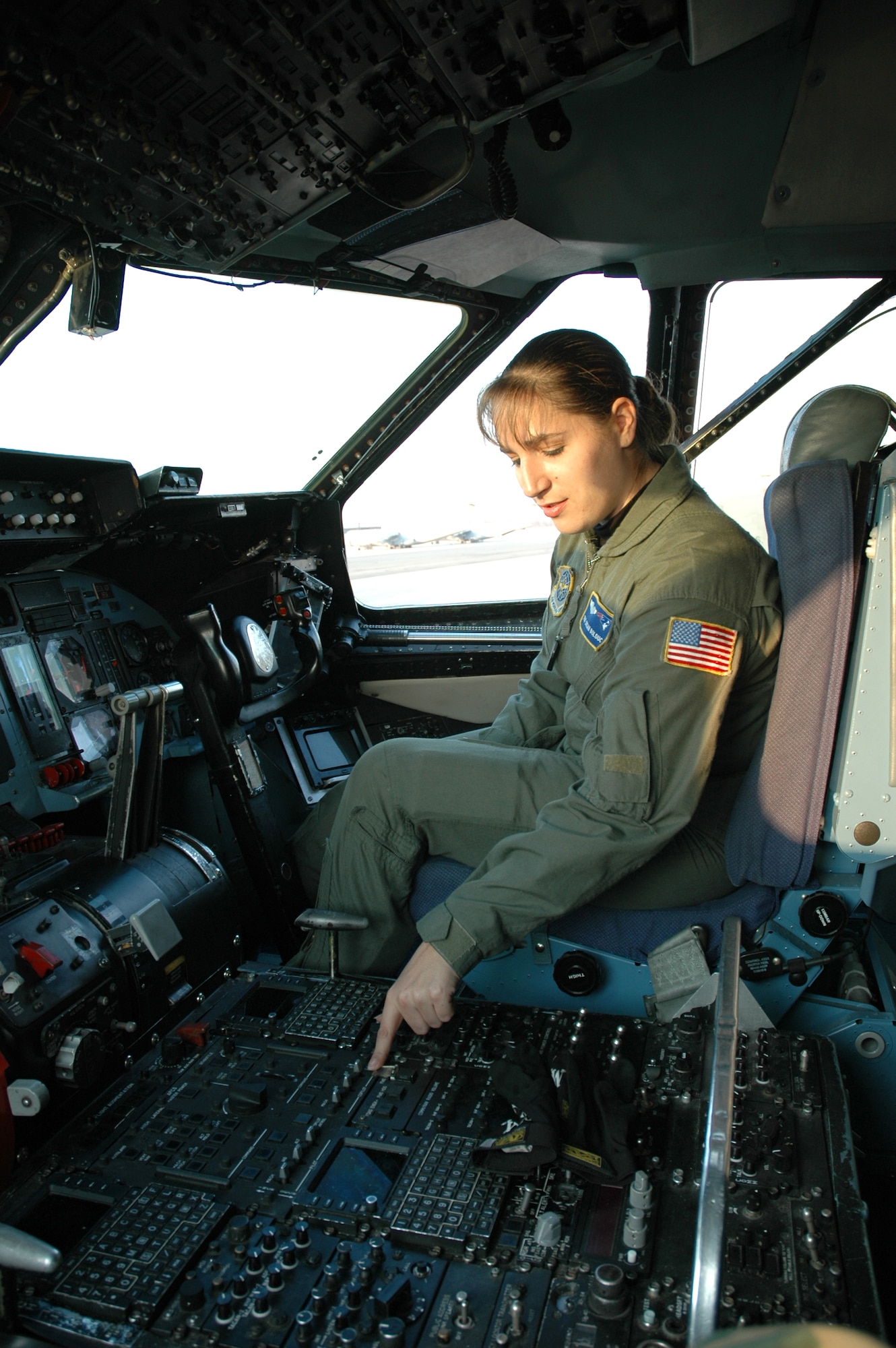 FLYING HIGH -- Staff Sgt. Susan Bolduc, 337th Airlift Squadron loadmaster, Westover Air Reserve Base, Mass., sits in her future workplace - the cockpit of a Patriot Wing C-5. Sergeant Bolduc recently learned she will attend Officer Training School. Once she earns her commission, she plans on pursuing her lifelong dream of being a C-5 pilot. (U.S. Air Force photo by Senior Master Sgt. Sandi Michon)