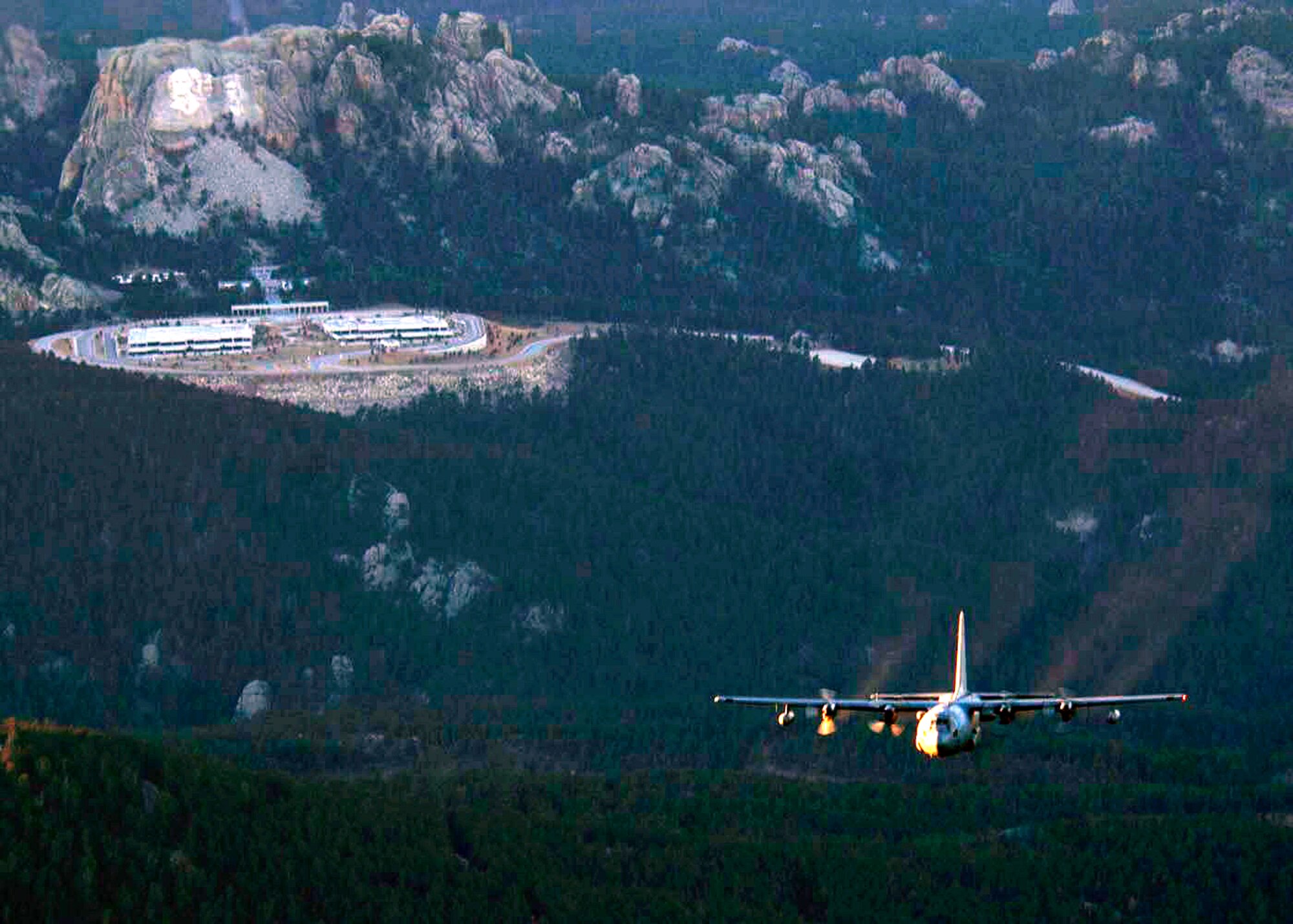 OVER SOUTH DAKOTA (AFPN) -- An EC-130H Compass Call aircraft flies past Mt. Rushmore during a training mission. The aircraft is from the 55th Electronic Combat Group at Davis-Monthan Air Force Base, Ariz. (U.S. Air Force photo by Airman 1st Class Christina D. Ponte)