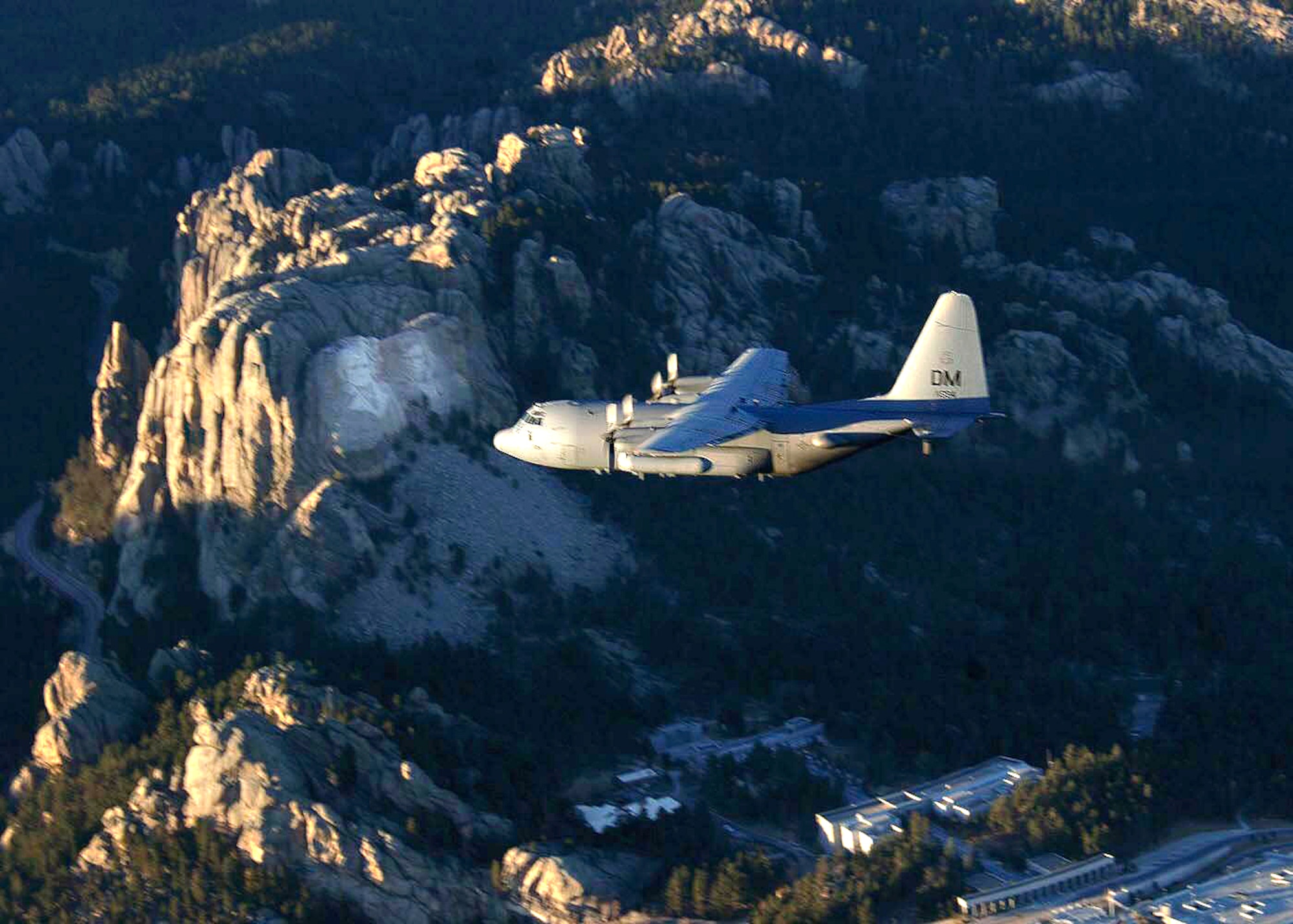 OVER SOUTH DAKOTA (AFPN) -- An EC-130H Compass Call aircraft flies over the Rocky Mountains during a training mission. The aircraft is from the 55th Electronic Combat Group at Davis-Monthan Air Force Base, Ariz. (U.S. Air Force photo by Airman 1st Class Christina D. Ponte)