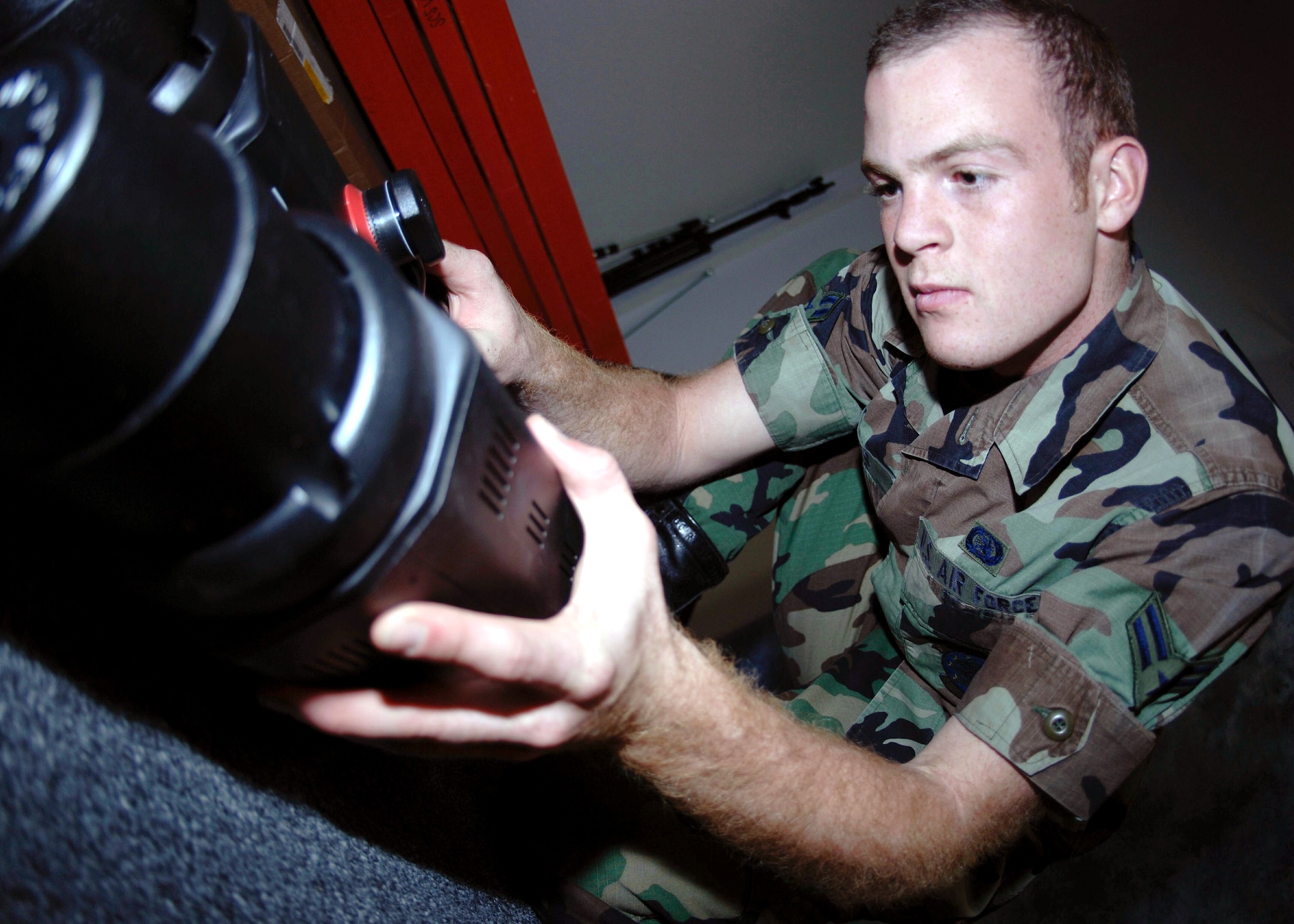 DAVIS-MONTHAN AIR FORCE BASE, Ariz. (AFPN) -- Airman 1st Class Jesse Shipps puts together a light for the base photo lab studio. The lab installed a new lighting grid and lights to update the studio, which increases the quality of official portraits. Airman Shipps is a still photographer with the 355th Communications Squadron. (U.S. Air Force photo by Airman 1st Class Christina D. Ponte)