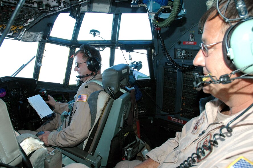 SOUTHWEST ASIA (AFPN) -- Senior Master Sgt. Eugene Busch looks out the cockpit of a C-130 Hercules aircraft during a mission in Iraq. Sergeant Busch is a flight engineer with the 746th Expeditionary Airlift Squadron. (U.S. Air Force photo by Master Sgt. Peter Borys)