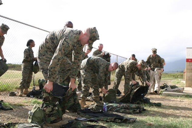 Marines don their MOPP gear before entering the gas chamber.  Marines are required to qualify once a year in the chamber.