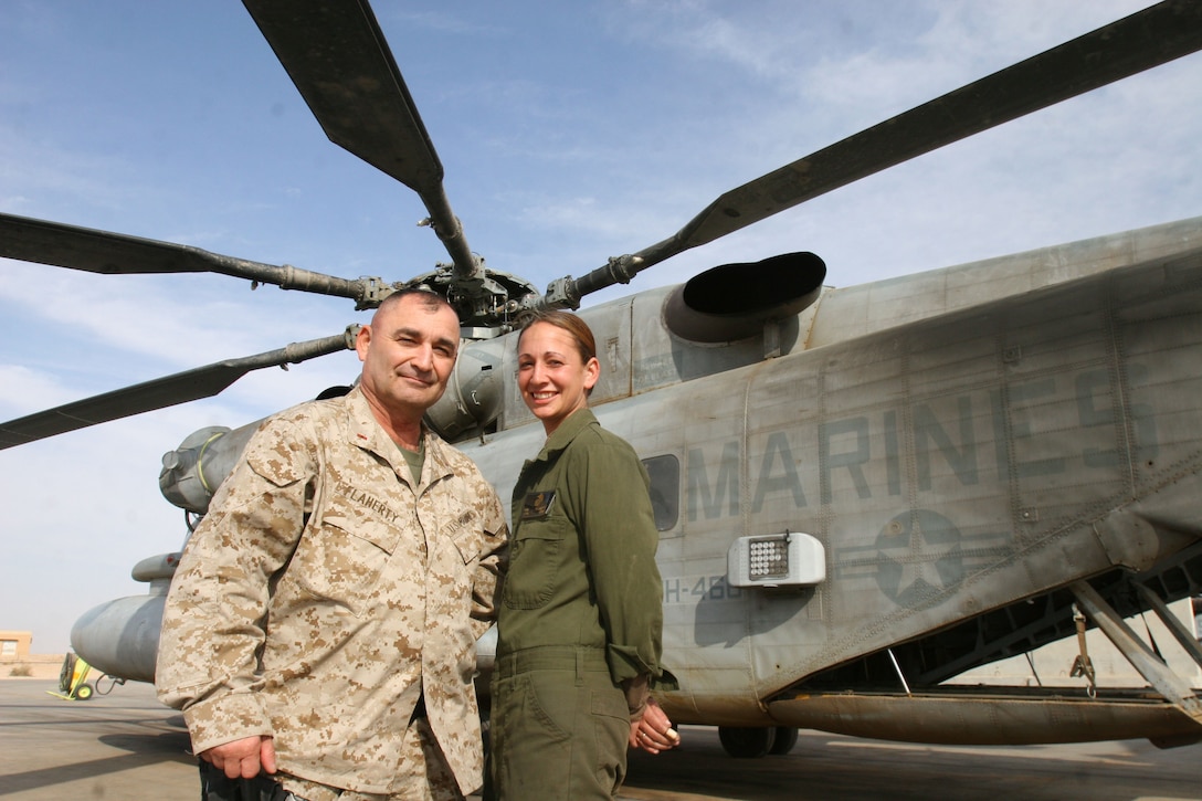 Lance Cpl. Shannon M. Flaherty, a 23-year-old, CH-53 avionics technician with Marine Medium Helicopter Squadron 466, deployed to Al Asad with the Wolfpack of HMH-466, based at Marine Corps Air Station Miramar, Calif., in September. Her father, Chief Warrant Officer 3 James M. Flaherty deployed to Fallujah in April. The 52-year-old infantry and engineer veteran works for II Marine Expeditionary Force?s command element, traveling to sites across Iraq to assist in base planning. The Marines recently had a chance to spend time together in Al Asad, Iraq.