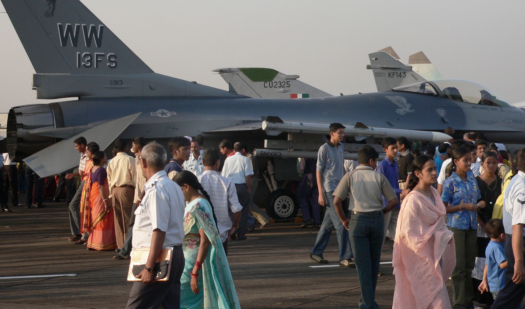 KALAIKUNDA AIR STATION, India (AFPN) -- Civilians flock to the flightline to see displays of U.S. and Indian Air Force aircraft. About 250 U.S. Airmen from five bases are participating in the Cope India exercise. The exercise provides an opportunity for the two air forces to enhance their ability to operate together. (U.S. Air Force photo by Capt. John Redfield) 