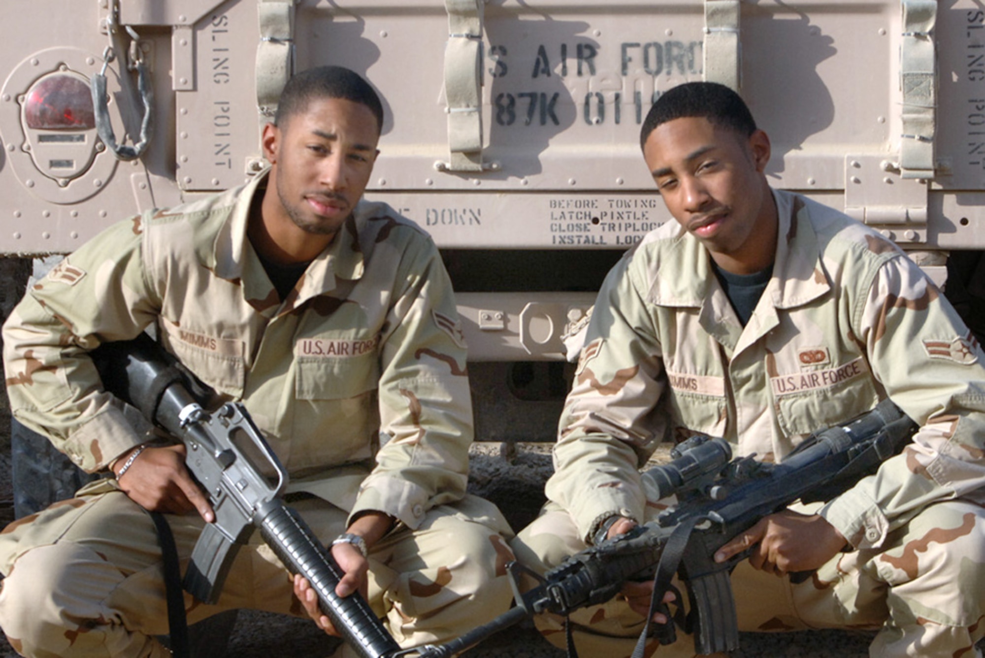 BAGHDAD, Iraq (AFPN) -- Airmen 1st Class Travis Mimms (left) and Terence Mimms are identical twins. They are assigned to separate bases in Florida and each did not know the other was deploying to the same location. Travis, a supply troop, deployed first from Hurlburt Field, Fla., and Terence, a security forces member, deployed from Eglin Air Force Base, Fla. (U.S. Air Force photo by Master Sgt. Randy L. Mitchell)