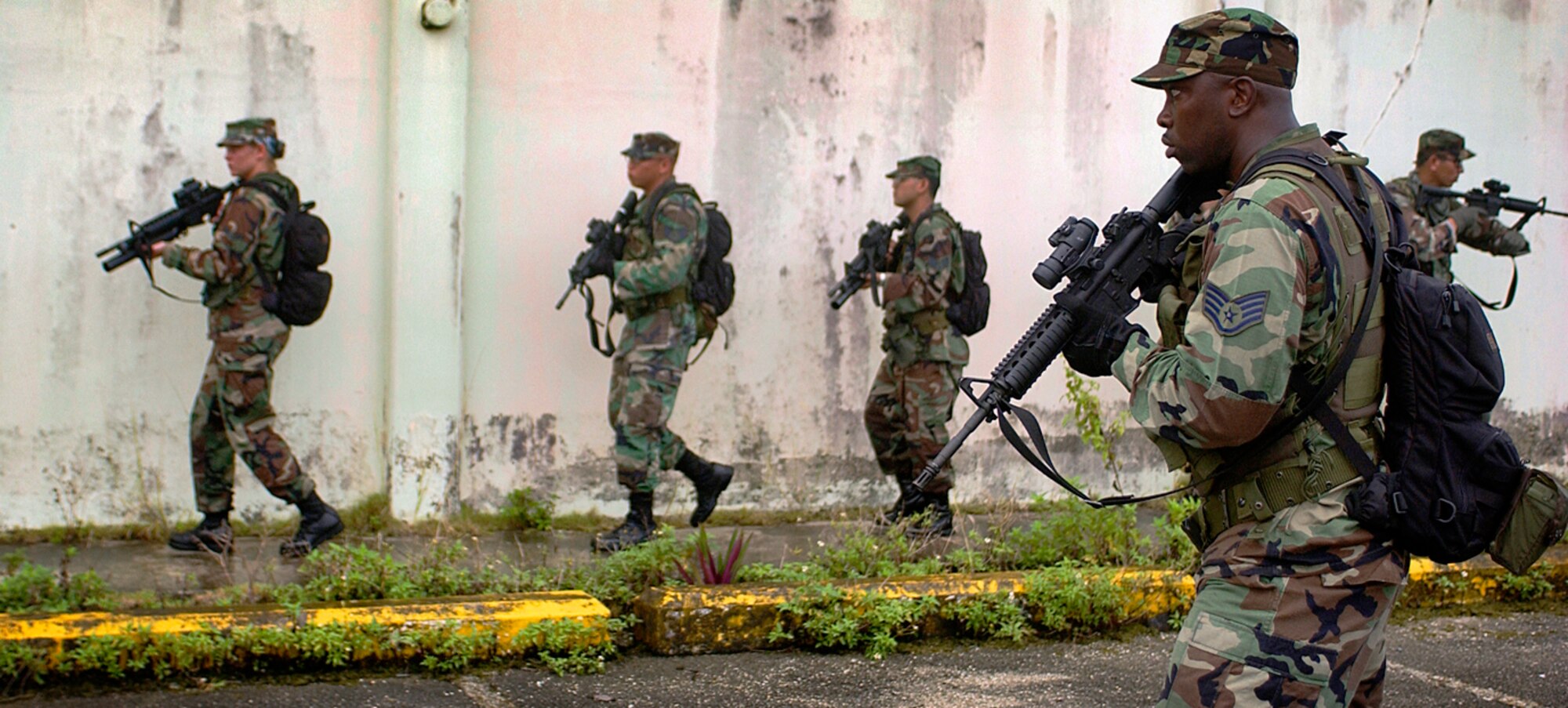 ANDERSEN AIR FORCE BASE, Guam (AFPN) -- Staff Sgt. Deroni Brown protects his tactical tracking team during a training mission. Airmen are learning tactical tracking techniques from the Guam Police Department during a weeklong course in the jungles of Guam. (U.S. Air Force photo by Staff Sgt. Bennie J. Davis III)