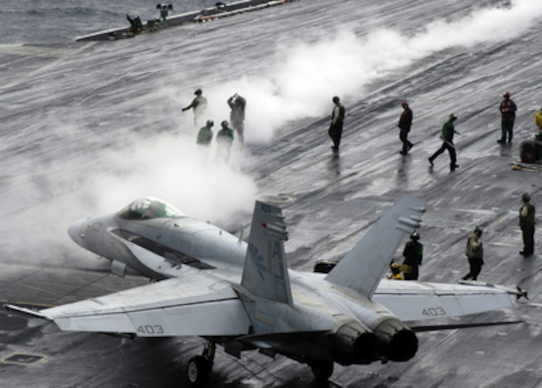 A Navy F/A-18C Hornet taxies to a steam-powered catapult on the flight deck of the aircraft carrier USS Theodore Roosevelt (CVN 71) as the ship conducts flight operations in the Persian Gulf on Nov. 16, 2005. The aircraft of Carrier Air Wing 8 are flying missions from the Roosevelt to support Operation Steel Curtain. The Hornet is attached to Strike Fighter Squadron 87 of Naval Air Station Oceana, Va. 