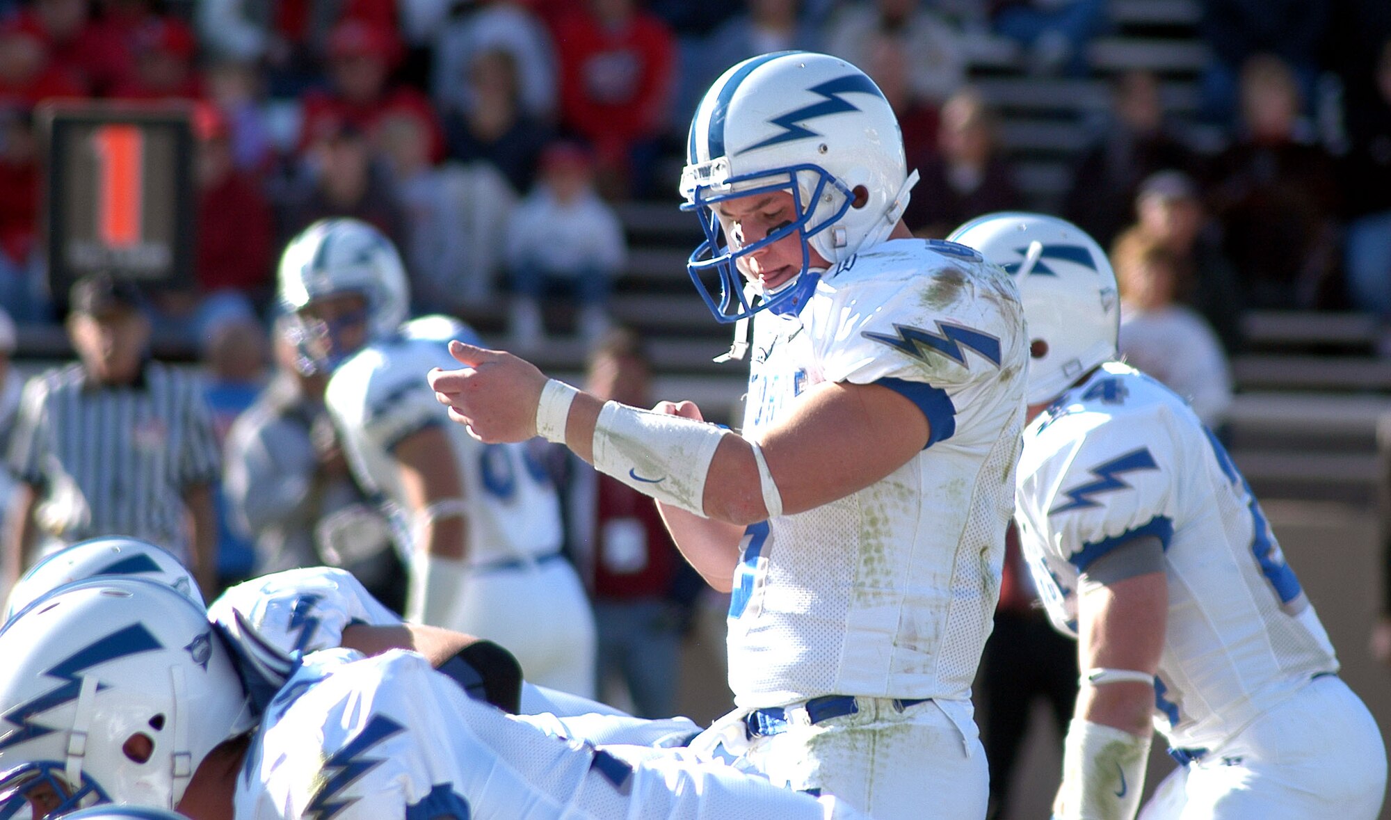 ALBUQUERQUE, N.M. (AFPN) -- Air Force quarterback Shaun Carney checks his wristband before calling signals at the line of scrimmage. (U.S. Air Force photo by John Van Winkle) 

