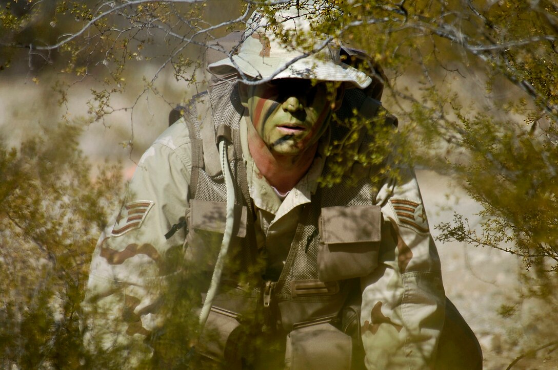 DAVIS-MONTHAN AIR FORCE BASE, Ariz. (AFPN) -- Staff Sgt. John Waters practices evasion maneuvers during a combat survival training course. The maneuvers are part of survival evasion resistance and escape training taught to pilots and aircrew members. Sergeant Waters is with the 43rd Electronic Combat Squadron.   (U.S. Air Force photo by Airman 1st Class Jesse Shipps) 