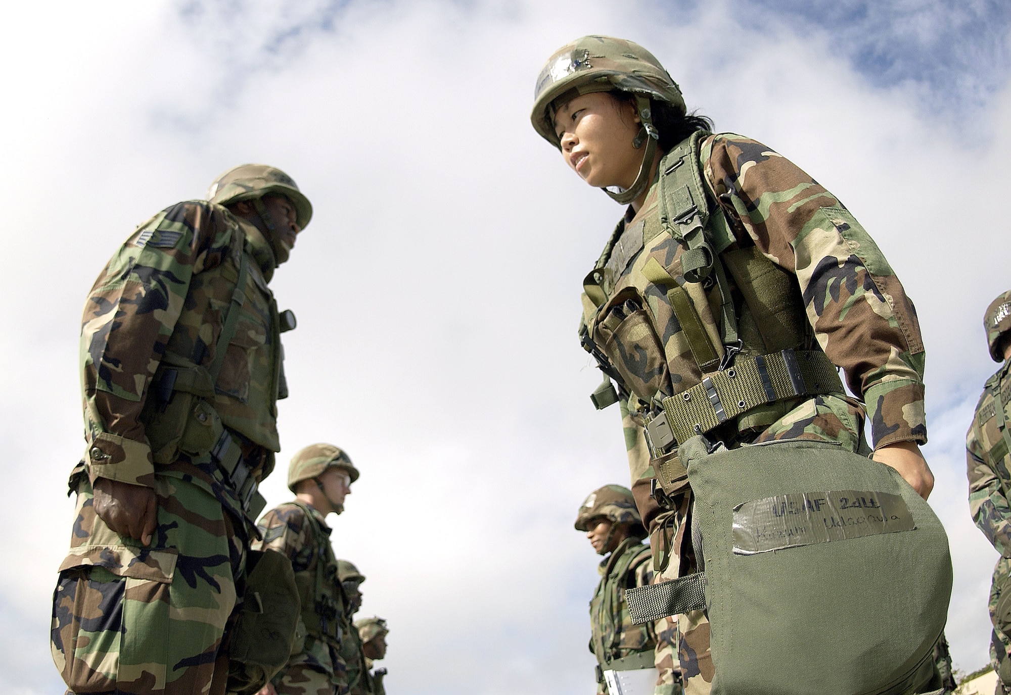ANDERSEN AIR FORCE BASE, Guam (AFPN) -- 2nd Lt. Kazumi Udagawa inspects Staff Sergeant Damien Seals during an open ranks inspection.  The 36th Civil Engineering Squadron here holds regular inspections to ensure troops have all of their necessary equipment for deployment. (U.S. Air Force photo by Airman 1st Class Miranda Moorer)