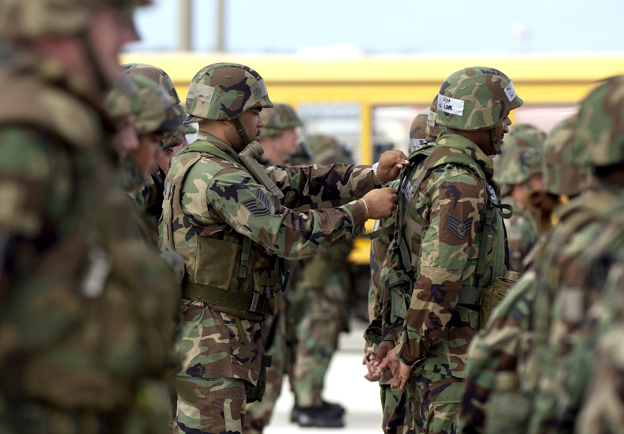 ANDERSEN AIR FORCE BASE, Guam (AFPN) -- Tech. Sgt. James Manuel adjusts Staff Sgt. Lavaughn Love's gear before an open ranks inspection.  The 36th Civil Engineering Squadron here holds regular inspections to ensure troops have all of their necessary equipment for deployment. (U.S. Air Force photo by Airman 1st Class Miranda Moorer)