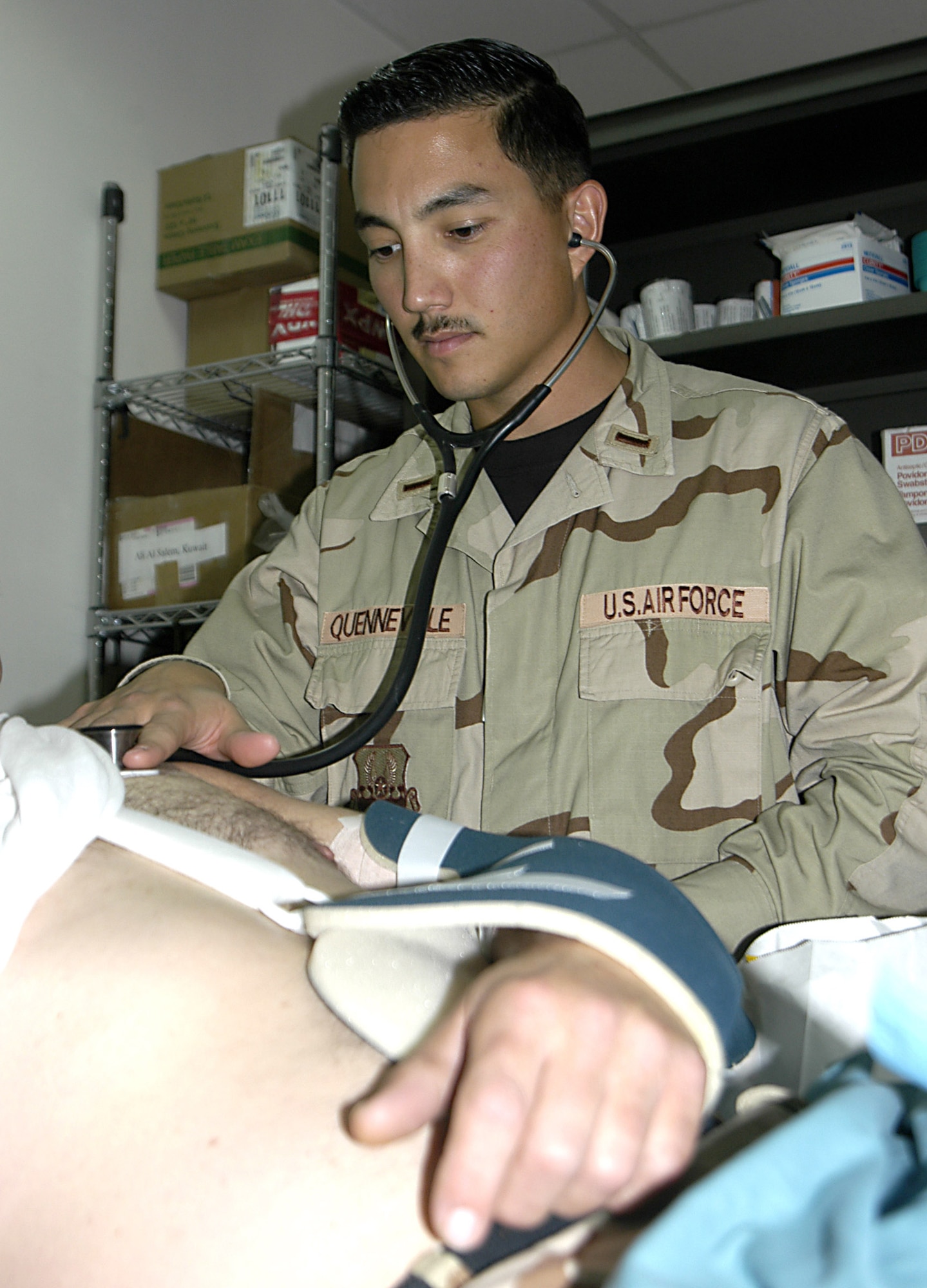 SOUTHWEST ASIA (AFPN) -- 2nd Lt. Ray Quenneville takes the vital signs of a patient involved in a bus accident.  Lieutenant Quenneville is with 386th Expeditionary Medical Group.   (U.S. Air Force photo) 