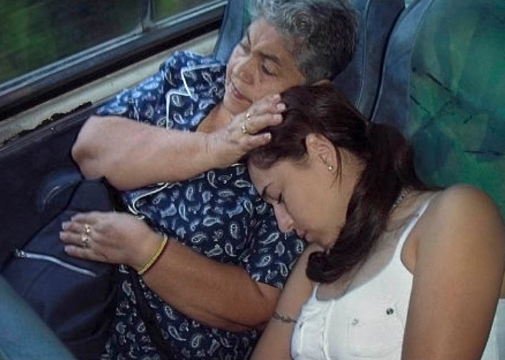 BELEN DE UMBRIA, Colombia (AFPN) -- Staff Sgt. Yaneth Alvarez shares a somber moment with her grandmother, Carmen Tulia, on a visit home. Sergeant Alverez says her grandmother, a seamstress, and her grandfather, Gonzalo Alvarez, a truck driver, worked long hours to provide for her and her family. (U.S. Air Force photo)