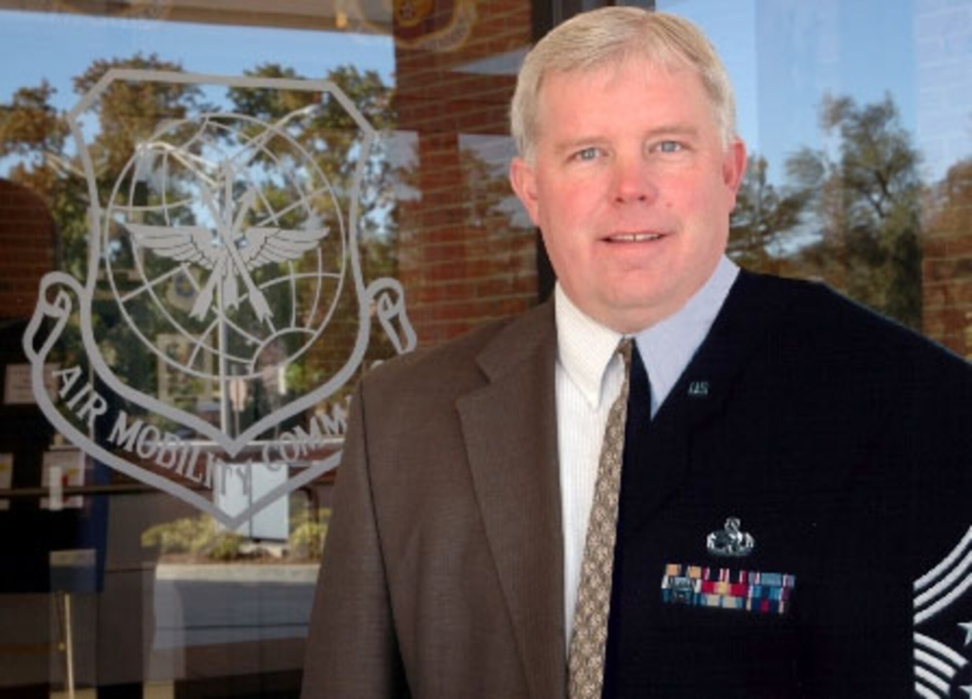 In addittion to being 932nd Airlift Wing senior enlisted advisor, Command Chief Master Sgt. Merle Lyman, plays a key part in Air Mobility Command as a civilian.