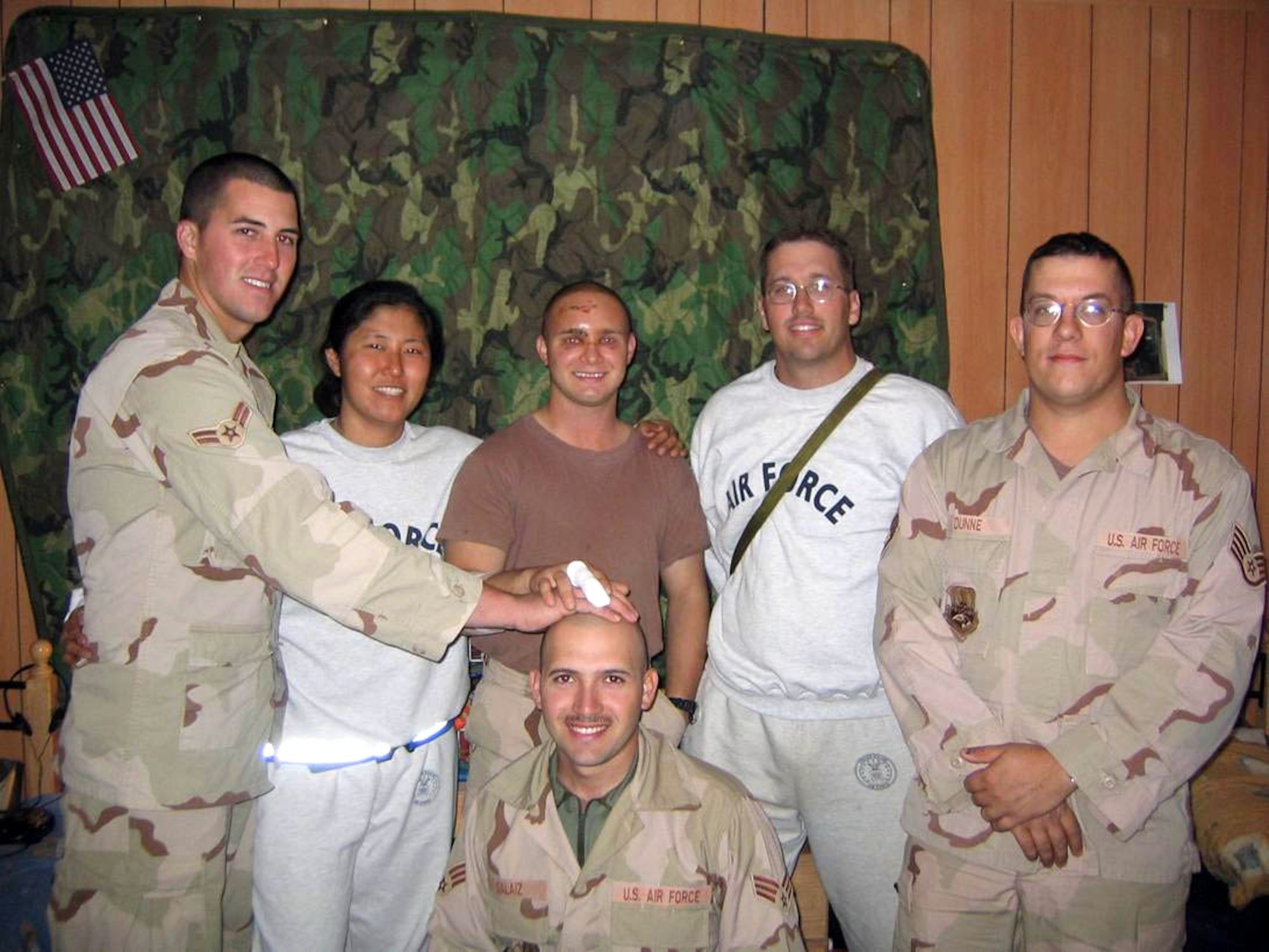 BALAD AIR BASE, Iraq -- Then-Senior Airman George Keen, then-Staff Sgt. Nina Cho, Senior Airman Brian Leverton, Tech. Sgt. Dan Verscha, Staff Sgt. David Dunne and Senior Airman Mario Salaiz relax in their barracks after Airmen Leverton and Salaiz and Sergeant Dunne survived a suicide bomb attack.  (U.S. Air Force photo)