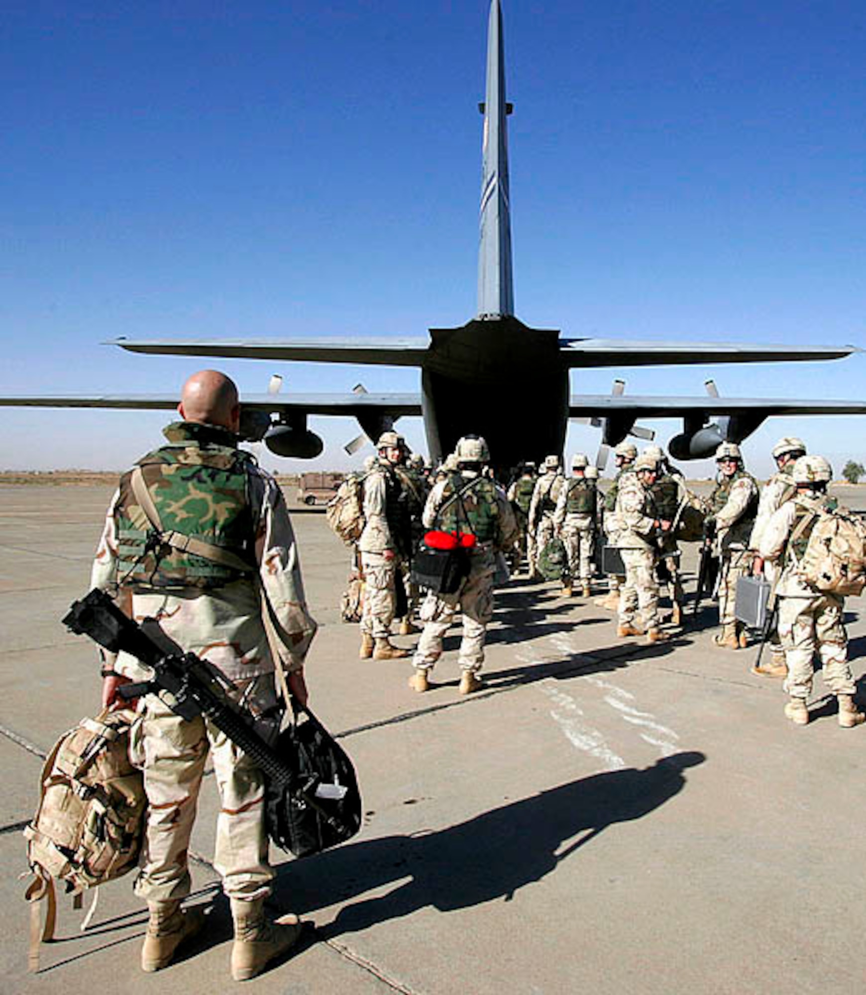 SOUTHWEST ASIA (AFPN) -- Troops "load up" at the U.S. Central Command Air Forces Aerial Port Control Center. The new center, which operates around the clock, is divided into three sections: the passenger reservations, cargo management and in-transit visibility. Airmen in passenger reservations section are responsible for passenger travel within the region and make more than 2,000 reservations a month. (U.S. Air Force photo by Lt Col. Mark Naumann)
