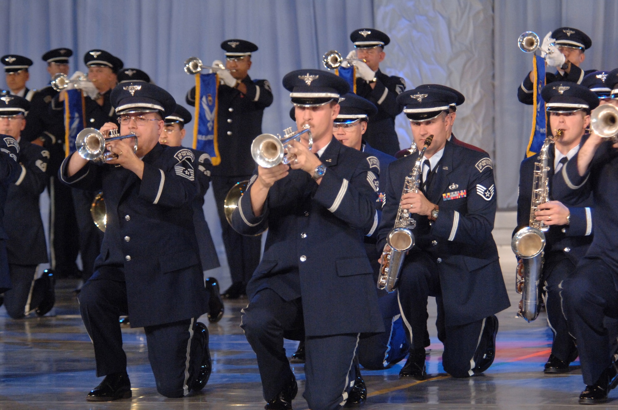TOKYO (AFPN) -- Members of a combined U.S. Air Force Band play during the Marching Festival 2005 at Budokan Hall, Tokyo, Japan. The two-day festival, featuring over 1,000 performers, showcased U.S. and Japanese military bands, taiko drummers and a ceremonial drill team. Over 50,000 people attended the weekend shows. Air Force band members from around the world participated in the program. (U.S. Air Force photo by Master Sgt. Val Gempis)