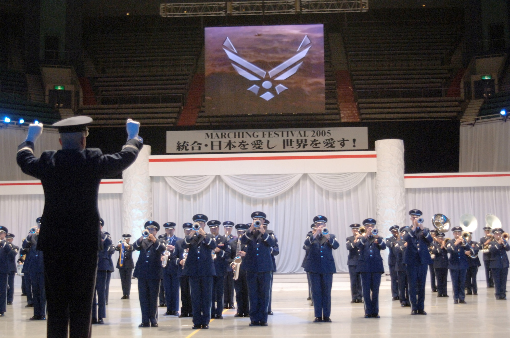 TOKYO (AFPN) -- Members of a combined U.S. Air Force Band, take center stage during the Marching Festival 2005 at Budokan Hall, Tokyo, Japan. The two-day festival, featuring over 1,000 performers, showcased U.S. and Japanese military bands, taiko drummers and a ceremonial drill team. Over 50,000 people attended the weekend shows. Air Force band members from around the world participated in the program. (U.S. Air Force photo by Master Sgt. Val Gempis)