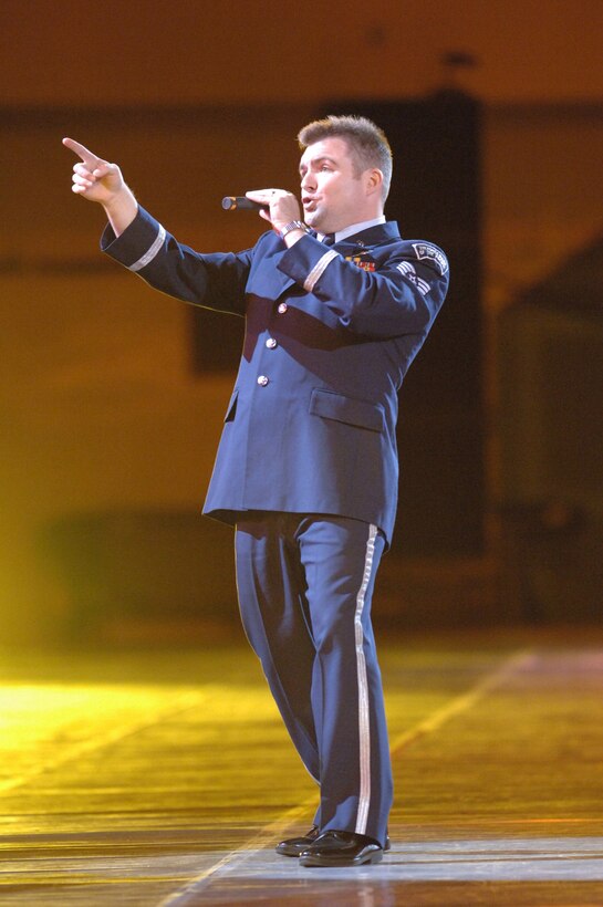 TOKYO (AFPN) -- Staff Sgt. Jamie Gilley takes center stage during the Marching Festival 2005 at Budokan Hall, Tokyo, Japan. The two-day festival, featuring over 1,000 performers, showcased U.S. and Japanese military bands, taiko drummers and a ceremonial drill team. Over 50,000 people attended the weekend shows. Air Force band members from around the world participated in the program. Sergeant Gilley is a member of the U.S. Air Force Band of the Pacific-Asia. (U.S. Air Force photo by Master Sgt. Val Gempis)