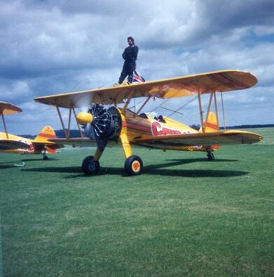 ENGLAND (AFMCNS) - Rick Penn, 66th Comptroller Squadron Financial
Analysis Branch chief, prepares for take off atop a Stearman biplane, which
he wing-walked in order to raise charitable funds. (Courtesy photo)