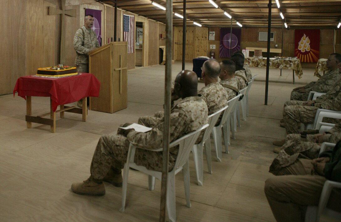 CAMP TAQADDUM, Iraq (Nov. 28, 2005) ? Brigadier Gen. John E. Wissler gives a speech here Nov. 28. Sailors, Marines and Soldiers came together under one roof to celebrate the 230th Navy Chaplain Corps?s birthday. Although the ceremony was minus the company of loved ones from home, everyone was in good spirits to be celebrating their proud tradition with 2nd Marine Logistics Group (Forward). Wissler is the commanding general of 2nd MLG (FWD).
