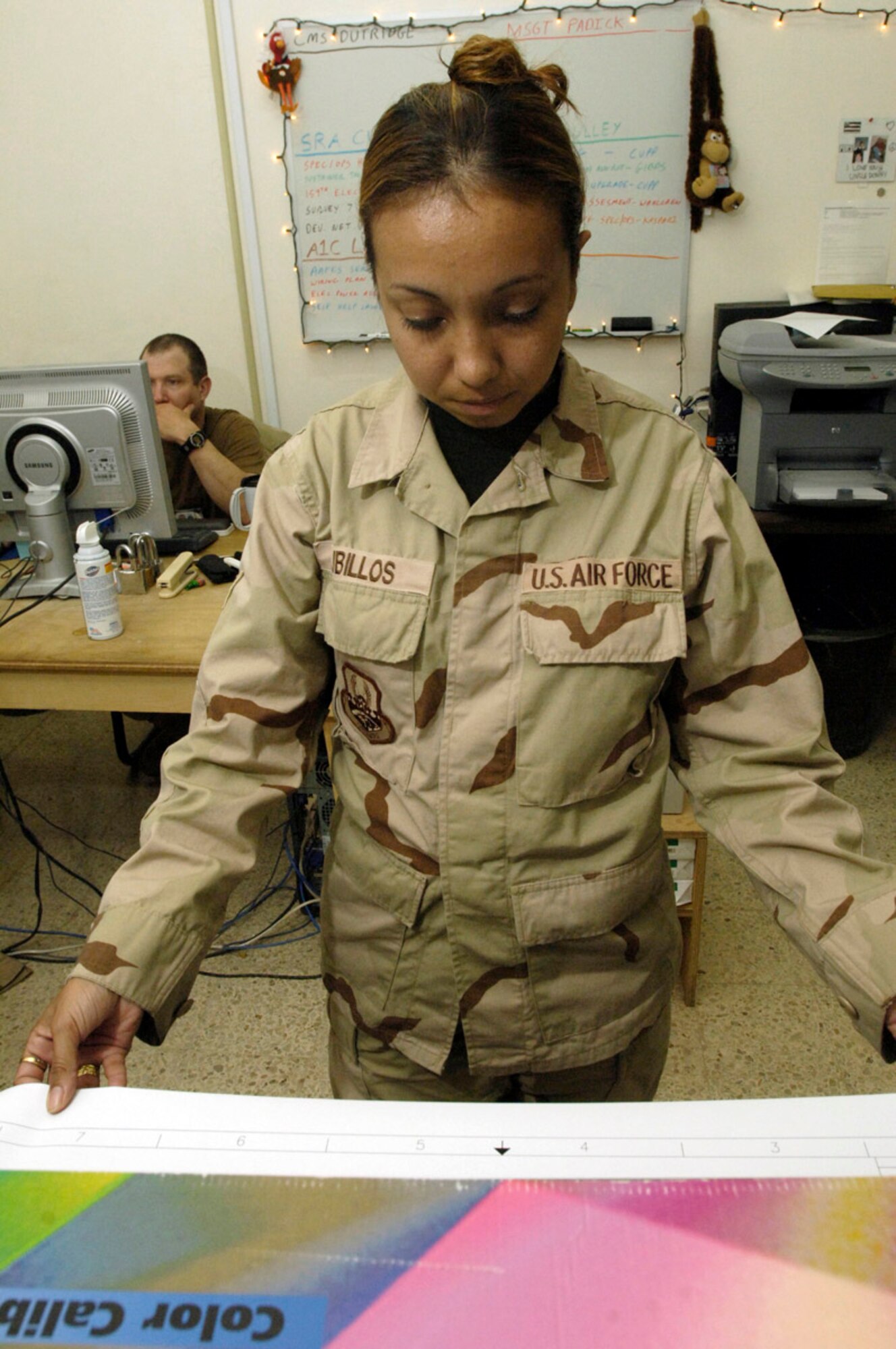 BALAD AIR BASE, Iraq (AFPN) -- Senior Airman Angelica Cubillos reviews a map. Airman Cubillos is with the 732nd Expeditionary Civil Engineer Squadron. (U.S. Air Force photo by Airman 1st Class Chad Watkins)