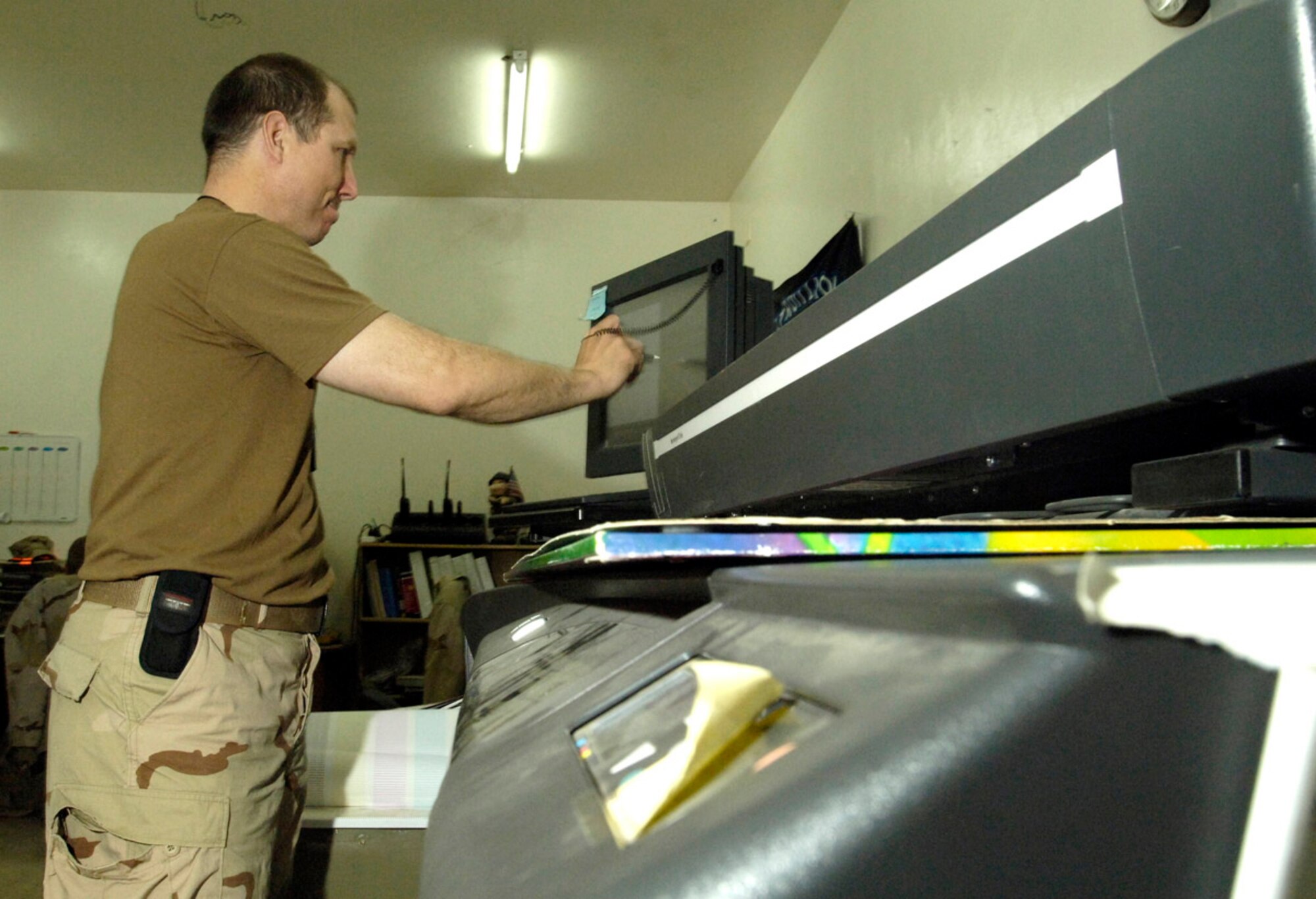 BALAD AIR BASE, Iraq (AFPN) -- Master Sgt. Bob Padick scans a document to be added to the continuity book. Sergeant Padick is with the 732nd Expeditionary Civil Engineer Squadron. (U.S. Air Force photo by Airman 1st Class Chad Watkins)