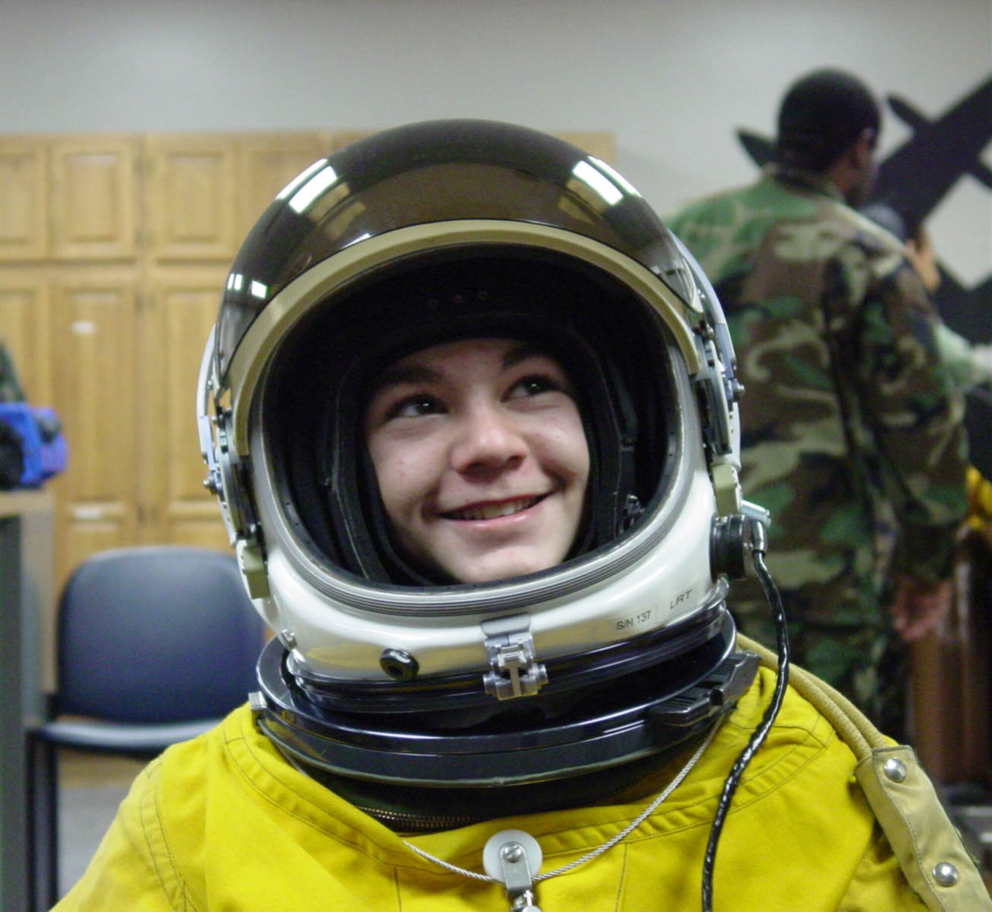 BEALE AIR FORCE BASE, Calif. (AFPN) -- Ryan Penne, then 13, reacts to being suited up in a pressure suit used by U-2 pilots when flying high altitude missions. Ryan and his family were given a tour of Beale last year as part of the Make-A-Wish program. It was during this tour that Ryan met Col. Darryl Burke, then vice commander of the 9th Reconnaissance Wing, who now commands the 380th Air Expeditionary Wing in Southwest Asia. (U.S. Air Force photo by Senior Airman Tim Jenkins)
