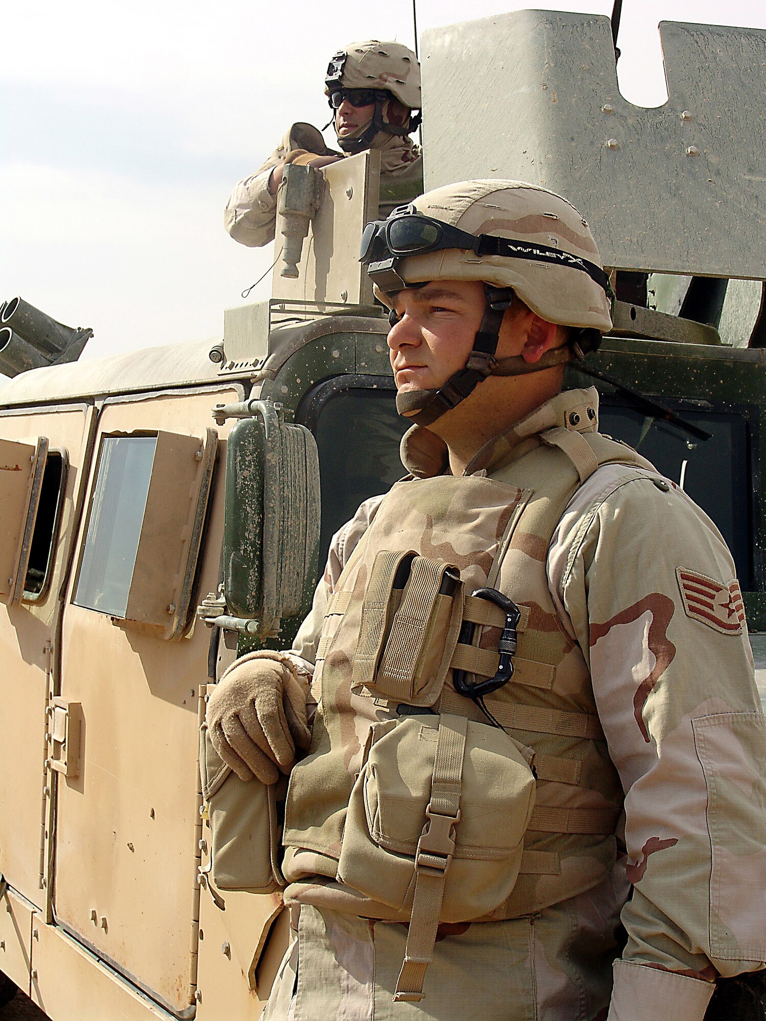 CAMP BUCCA, Iraq (AFPN) -- Staff Sgt. Jay Westerterd and Airman 1st Class Christopher Miranda provide security while squadron members conduct security operations. More than 750 Airmen are deployed here providing security for convoys and the base. Sergeant Westerterd and Airman Miranda are with the 586th Expeditionary Security Forces Squadron.  (U.S. Air Force photo)
