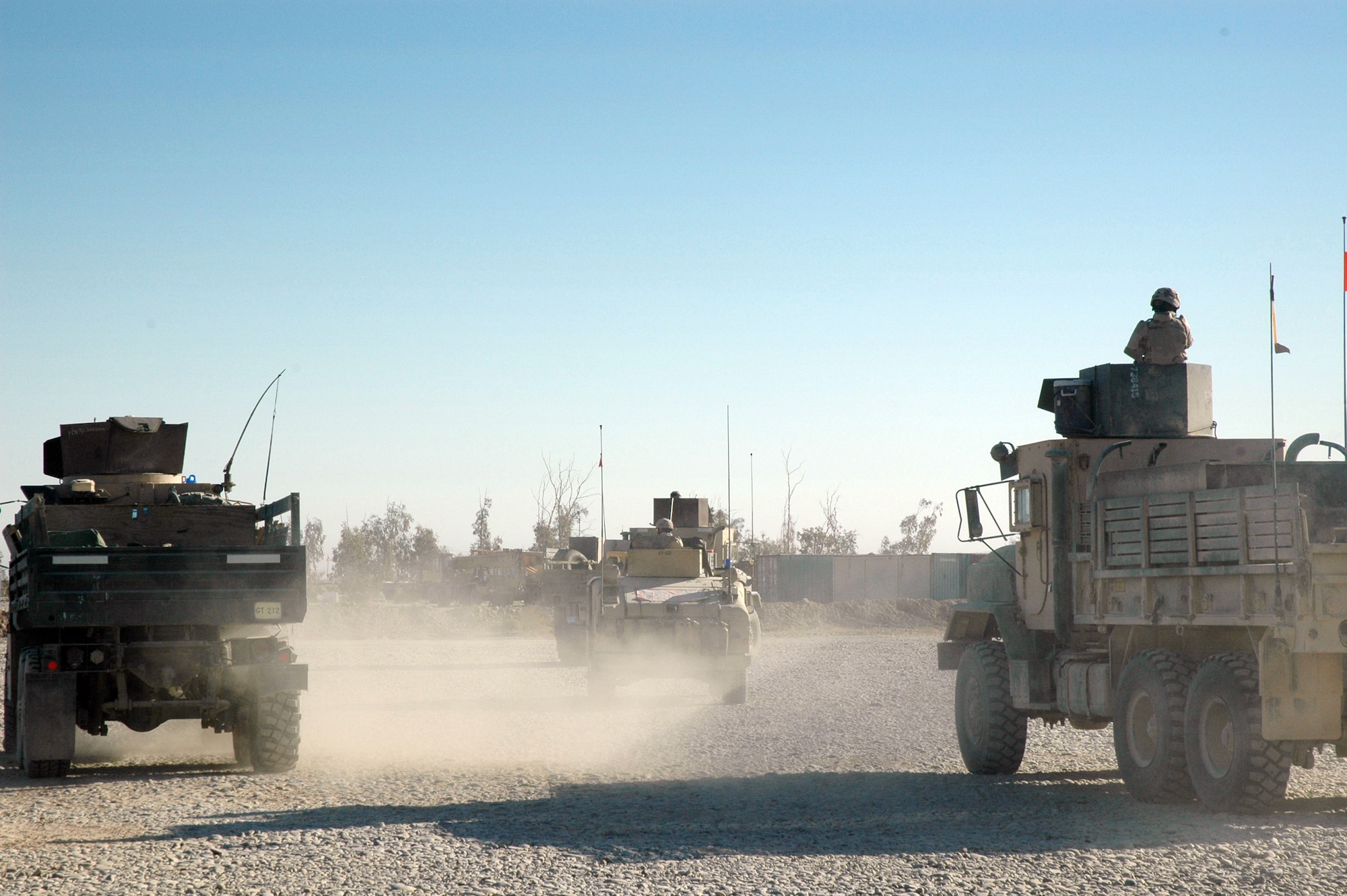 TIKRIT, Iraq (AFPN) -- Airmen assigned to the 723rd Expeditionary Logistics Readiness Squadron depart base Speicher to escort a truck convoy. The Airmen ensure passengers and cargo reach their destinations throughout Iraq. (U.S. Air Force photo by Maj. Robert Couse-Baker)