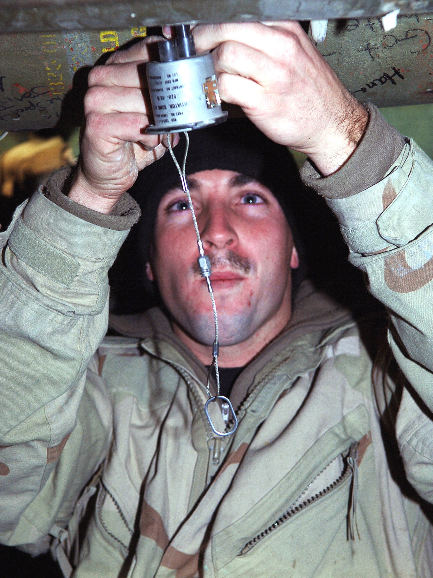 BAGRAM AIR FIELD, Afghanistan (AFPN) -- Senior Airman Edward Stottlemyer inspects a bomb fuse initiator. The FZU-48/B supplies electrical power to the FMU-139 electrical tail fuse on a built-up GBU-12. Since Sept. 15, the 455th munitions flight provided more than 23,000 rounds of 30mm ammunition, 15,000 countermeasures, 103 rockets, 14 500-pound air burst bombs and nine laser-guided bombs in support of the ongoing global war on terrorism. Airman Stottlemyer from  Beaufort, S.C., is deployed from Davis-Monthan Air Force Base, Ariz. (U.S. Air Force photo by Staff Sgt. Marcus McDonald) 