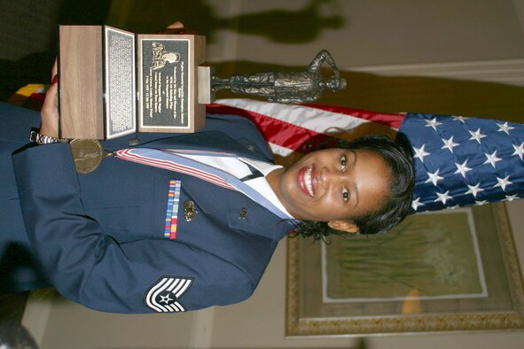 Tech Sgt. Courtney Knight accepts the Billy Hughes Award for 2005 during an on-base banquet Nov. 11. The award is presented to a reservist who best demonstrates Air Force core values. (U.S. Air Force photo by Capt. Billy Pierce.)