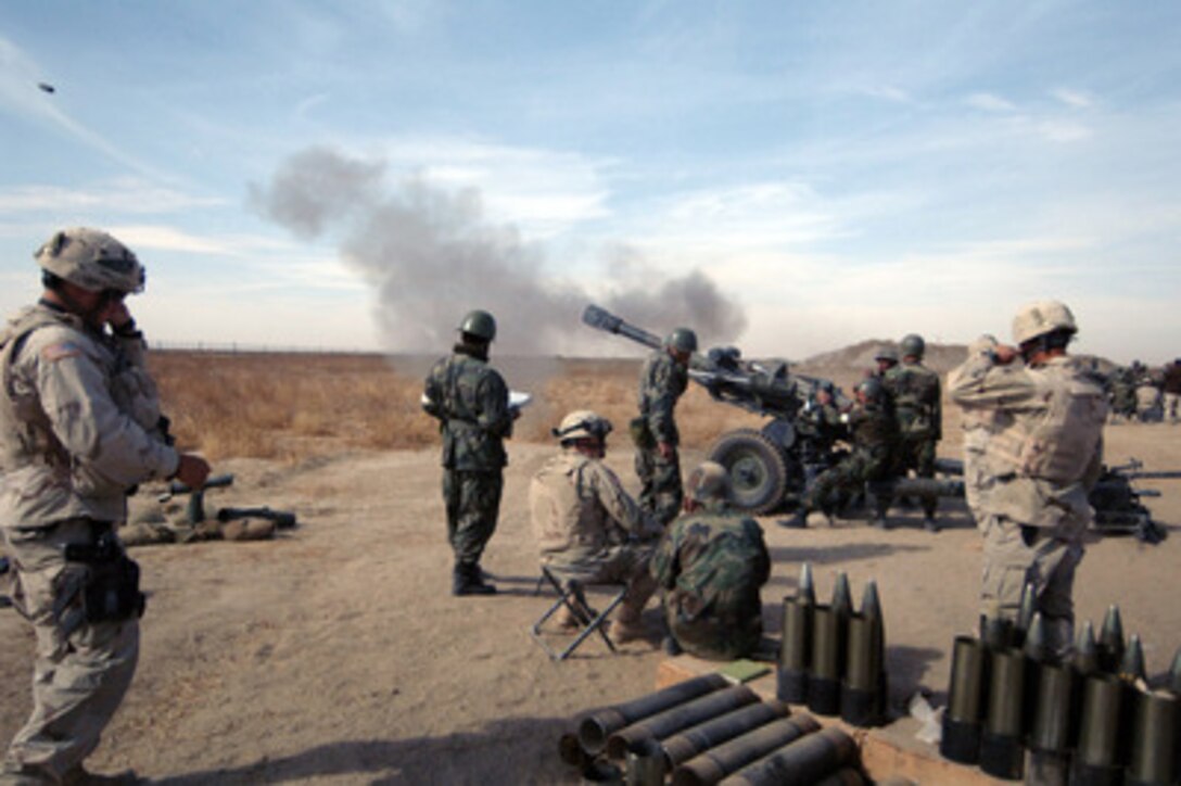 An artillery shell hurtles from an M-119 Howitzer during a joint training exercise at Kandahar Airfield, Afghanistan, on Nov. 17, 2005. U.S. Army soldiers from the 3rd Battalion, 319th Task Force are instructing Afghan National Army soldiers on the live fire procedures of the M-119 Howitzer. 