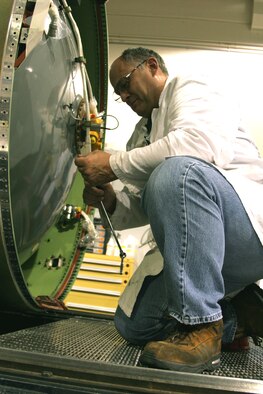 HILL AIR FORCE BASE, Utah (AFPN) -- Greg House inspects the first stage safe-and-arm device. Mr. House is an ordnance equipment mechanic inthe 309th Missile Maintenance Group. (U.S. Air Force photo by G. A. Volb)