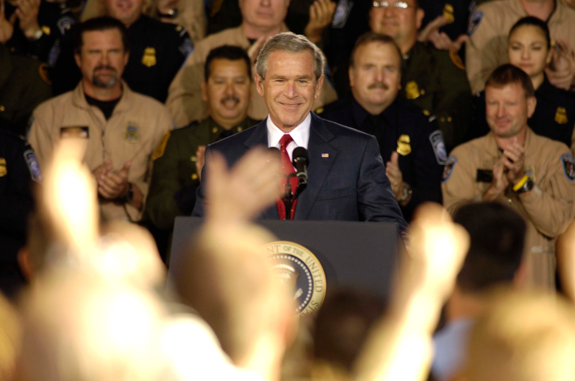 DAVIS-MONTHAN AIR FORCE BASE, Ariz. (AFPN) -- President George W. Bush speaks at a U.S. Border Patrol hanger. President Bush came to speak about current border patrol issues and immigration laws and policies. (U.S. Air Force photo by Airman 1st Class Jesse Shipps)
