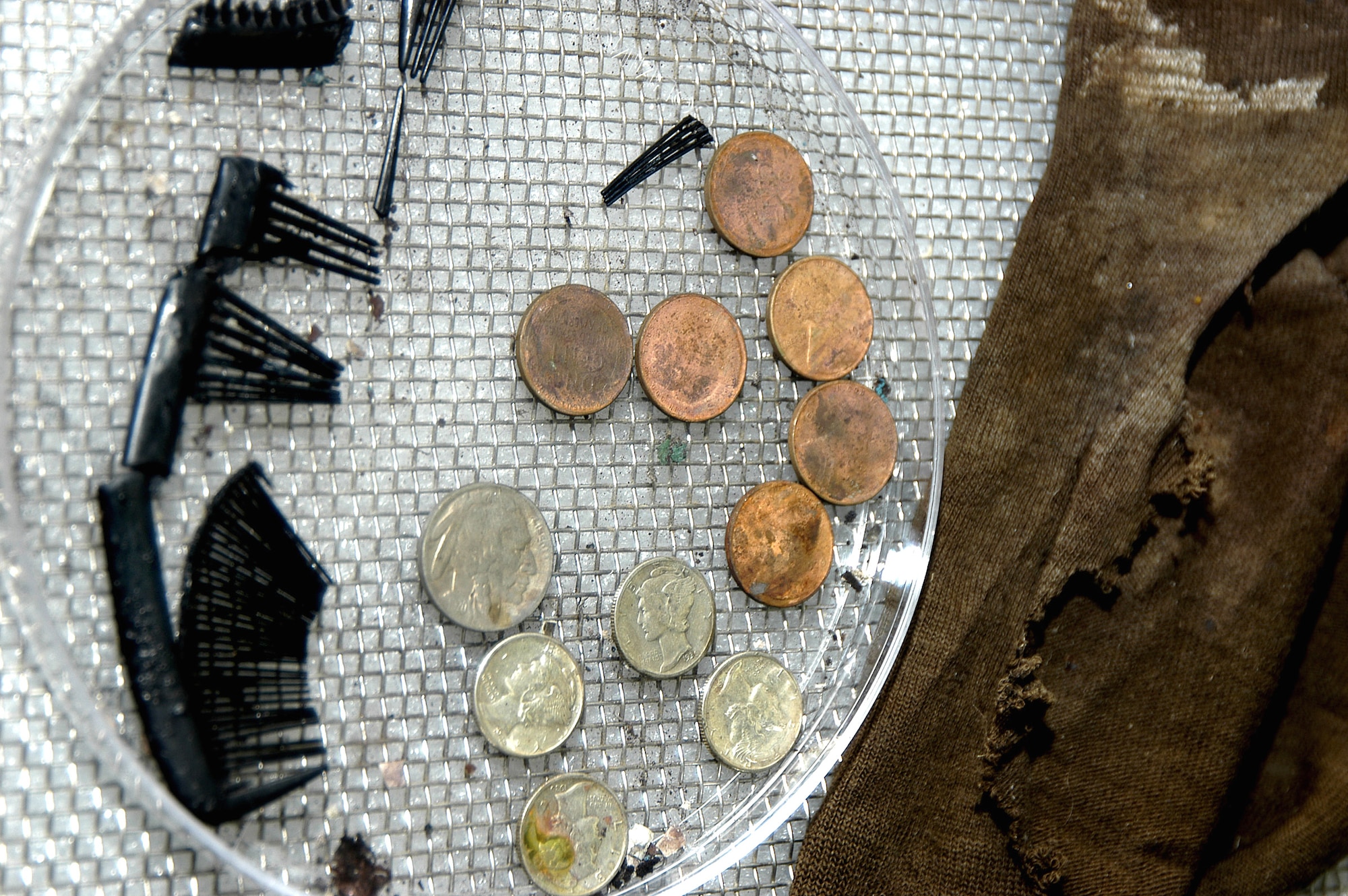 HICKAM AIR FORCE BASE, Hawaii (AFPN) -- Joint POW/MIA Accounting Command scientists are working to identify an Airman who was found Oct. 16 on Mount Mendel in Kings Canyon National Park, Calif.  The unidentified Airman arrived at JPAC Oct. 24 still wearing a World War II-era parachute, with a comb, various coins and other personal effects in his pockets. Investigators at JPAC searched the records of men lost during World War II and found that between 25 and 30 military planes crashed on training missions in California during these years. They have narrowed the list of possible Airmen to four who disappeared during a training mission on Nov. 18, 1942. (U.S. Air Force photo by Staff Sgt. Derrick C. Goode)