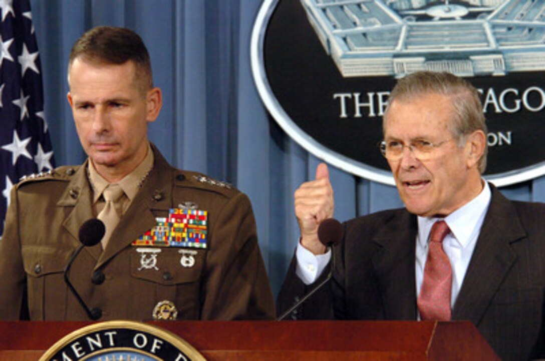 Secretary of Defense Donald H. Rumsfeld responds to a reporter's question during a press briefing with Chairman of the Joint Chiefs of Staff Gen. Peter Pace, U.S. Marine Corps, in the Pentagon on Nov. 29, 2005. Rumsfeld and Pace updated reporters on current operations and some of the progress of Iraqis in taking control of their country. 
