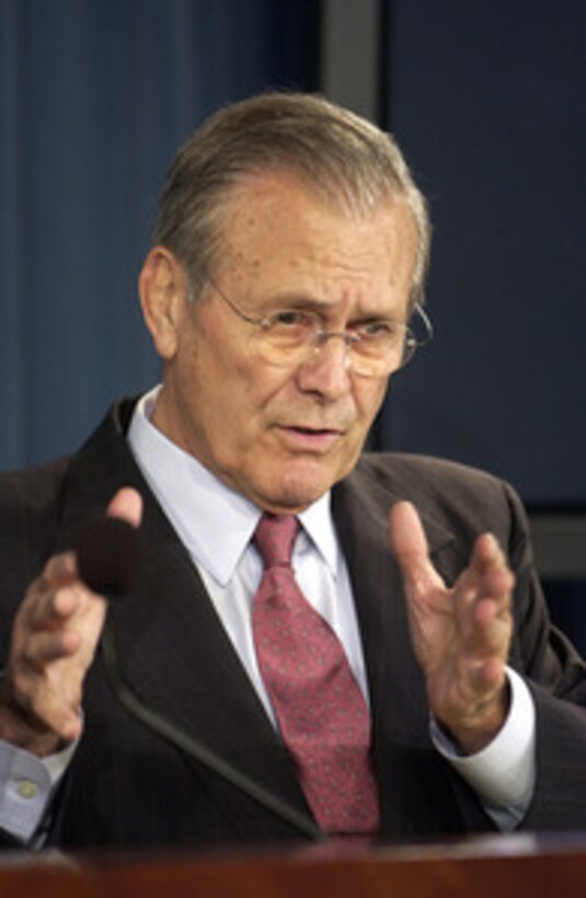 Secretary of Defense Donald H. Rumsfeld responds to a reporter's question during a press briefing with Chairman of the Joint Chiefs of Staff Gen. Peter Pace, U.S. Marine Corps, in the Pentagon on Nov. 29, 2005. Rumsfeld and Pace updated reporters on current operations and some of the progress of Iraqis in taking control of their country. 