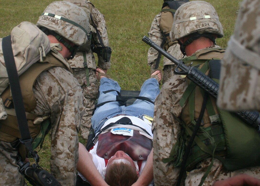 A "casualty" relaxes as Marines from MEU Service Support Group 22 carry him toward a waiting helicopter during a mass casualty exercise conducted during the 22nd Marine Expeditionary Unit's recent Certification Exercise (CERTEX), Oct. 1, 2005.  The mass casualty exercise was one of several missions the MEU undertook during CERTEX.