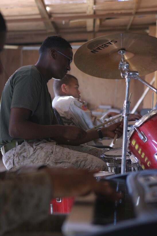 CAMP TAQADDUM, Iraq (Oct. 3, 2005) ? Members of the Camp Taqaddum gospel band play here Oct. 2. The band, made up of 15 service members from the Marine Corps, Army, and Navy, performs in front of a respectively large crowd of worshippers at the Taqaddum chapel every week.