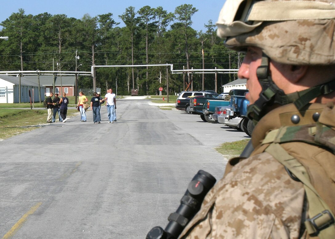 A rifleman with Bravo Co., Battalion Landing Team 1st Bn., 2nd Marines stands guard outside an evacuation control center (ECC) during a noncombatant evacuation operation (NEO) exercise aboard Camp Lejeune during the 22nd Marine Expeditionary Unit's recent Certification Exercise (CERTEX), Oct. 2, 2005.  BLT 1/2 is the MEU's ground combat element, and is scheduled to deploy later this year.
