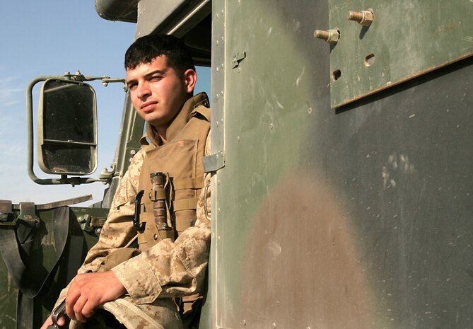 Cpl. Daniel W. Phipps, ambulance driver, Battalion Aid Station, Combat Logistics Battalion 8, 2nd Force Service Support Group (FWD), stands in the CLB-8 BAS here Oct. 6. In the two years Phipps has been in the Corps, he has been on three deployments, and recently volunteered to extend here.