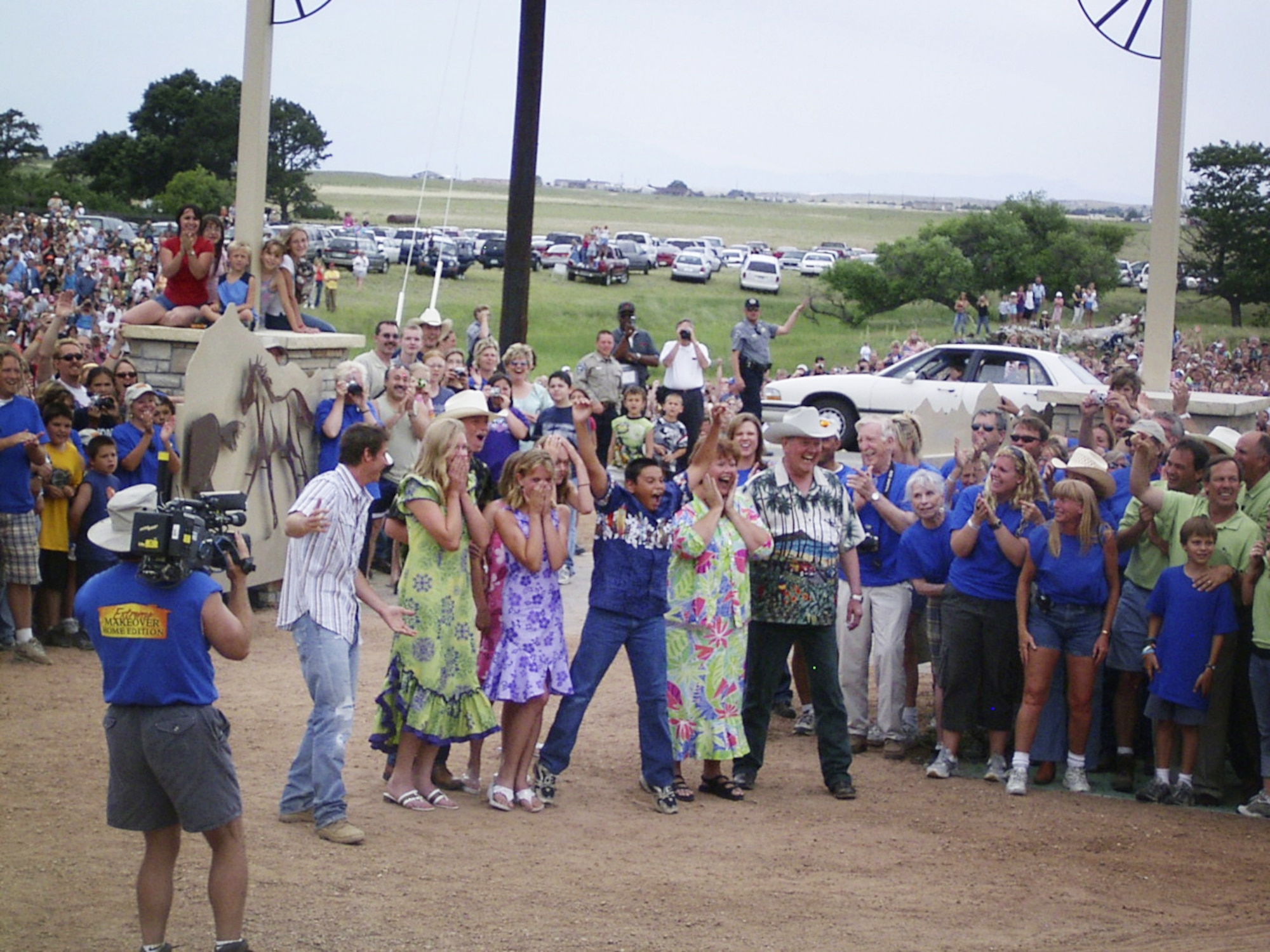 PEYTON, Colo. -- "Extreme Home Makeover" host Ty Pennington (left) helps the Barretts celebrate the instant they see their new home for the first time July 17.  The ABC show aired nationally Oct. 2.  (U.S. Air Force photo by Kelly Peterson)  