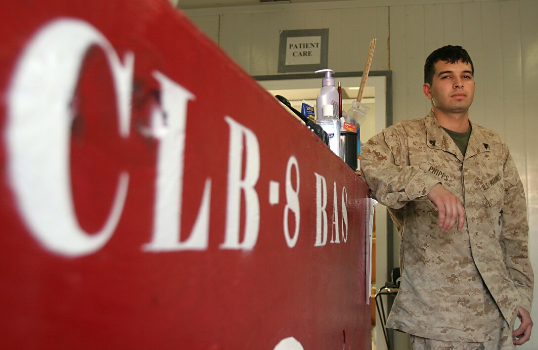 Cpl. Daniel W. Phipps, ambulance driver, Battalion Aid Station, Combat Logistics Battalion 8, 2nd Force Service Support Group (FWD), stands in the CLB-8 BAS here Oct. 6. In the two years Phipps has been in the Corps, he has been on three deployments, and recently volunteered to extend here.