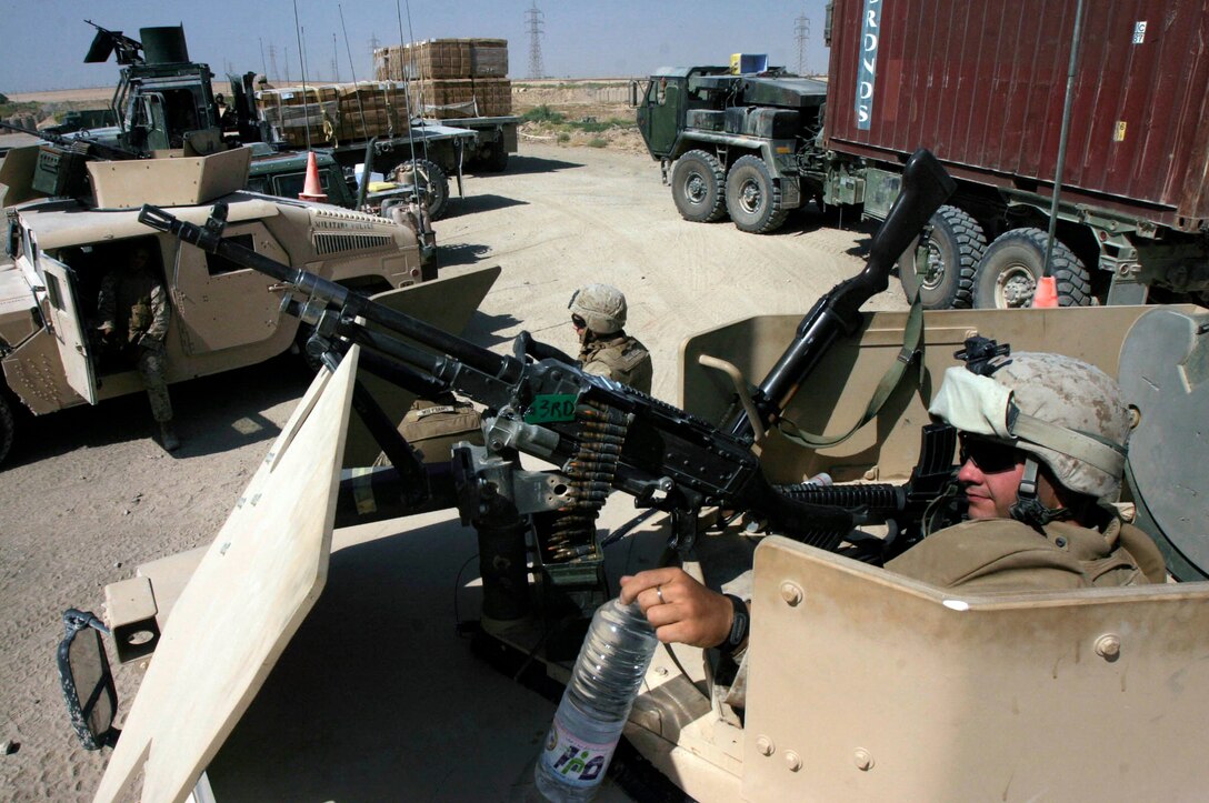Lance Cpl. Joseph D. Canale, takes a break after his unit successfully escorted a re-supply convoy to one of Fallujah?s many forward observation bases. Canale is a military policeman assigned to Combat Logistics Battalion Eight, MP Detachment, Alpha Company, 2nd Force Service Support Group (Forward). The battalion?s MP?s are tasked with providing security for virtually all vehicle movements outside of Camp Fallujah, Iraq. (Official Marine Corps photo by Sgt. Josh H. Hauser)(Released)